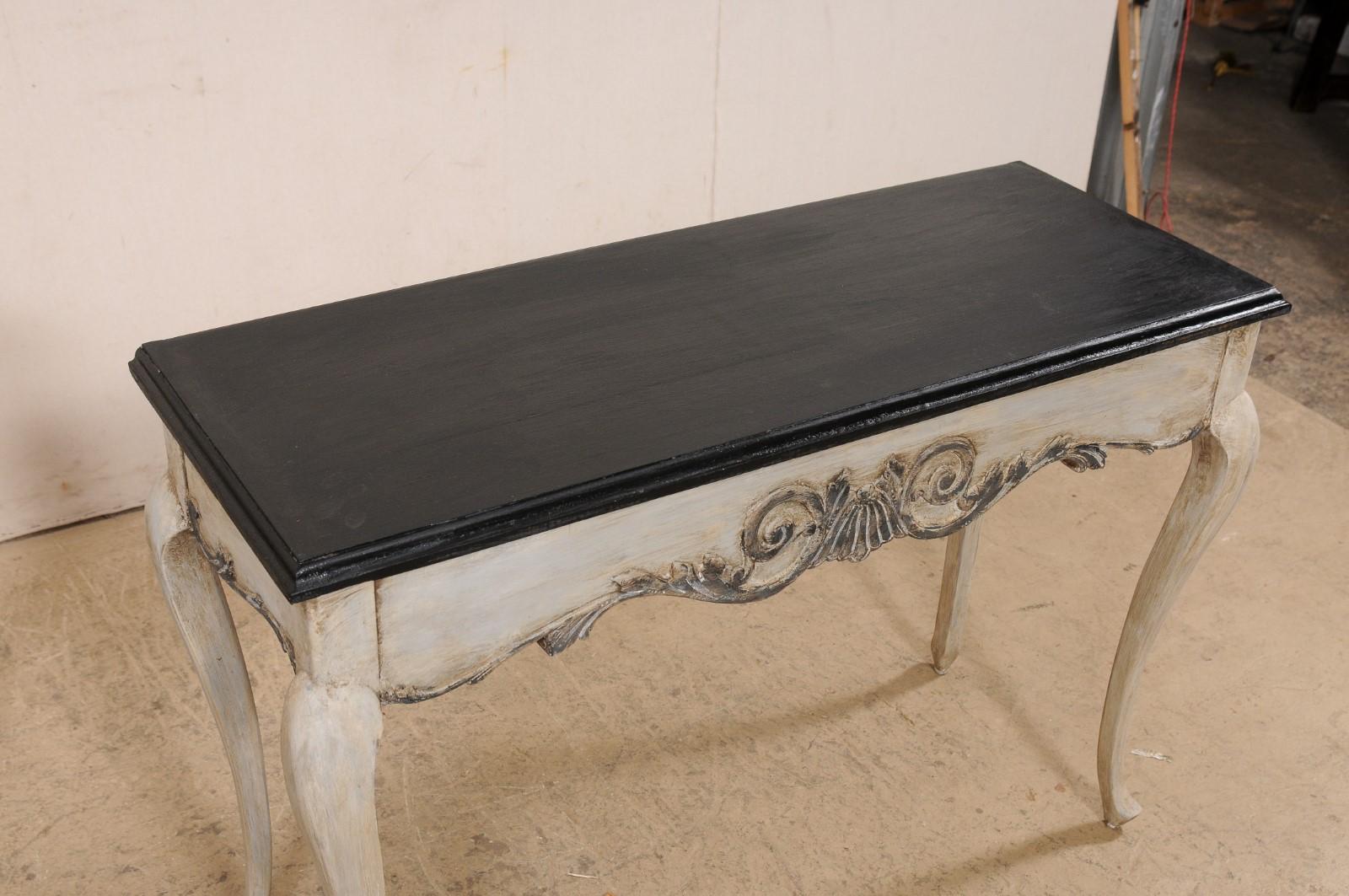 French Pair of Carved Wall Consoles w/Scalloped Skirting, Black Tops w/Greige For Sale 1