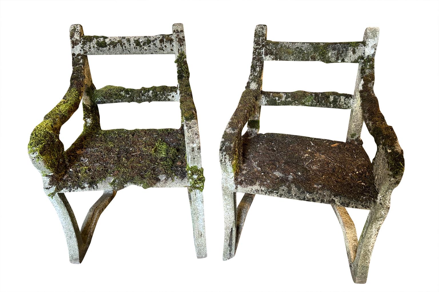 A terrific early 20th century Pair of Cement Garden Chairs in the Directoire style from the Provence region of France.  The seat height is 16 1/4