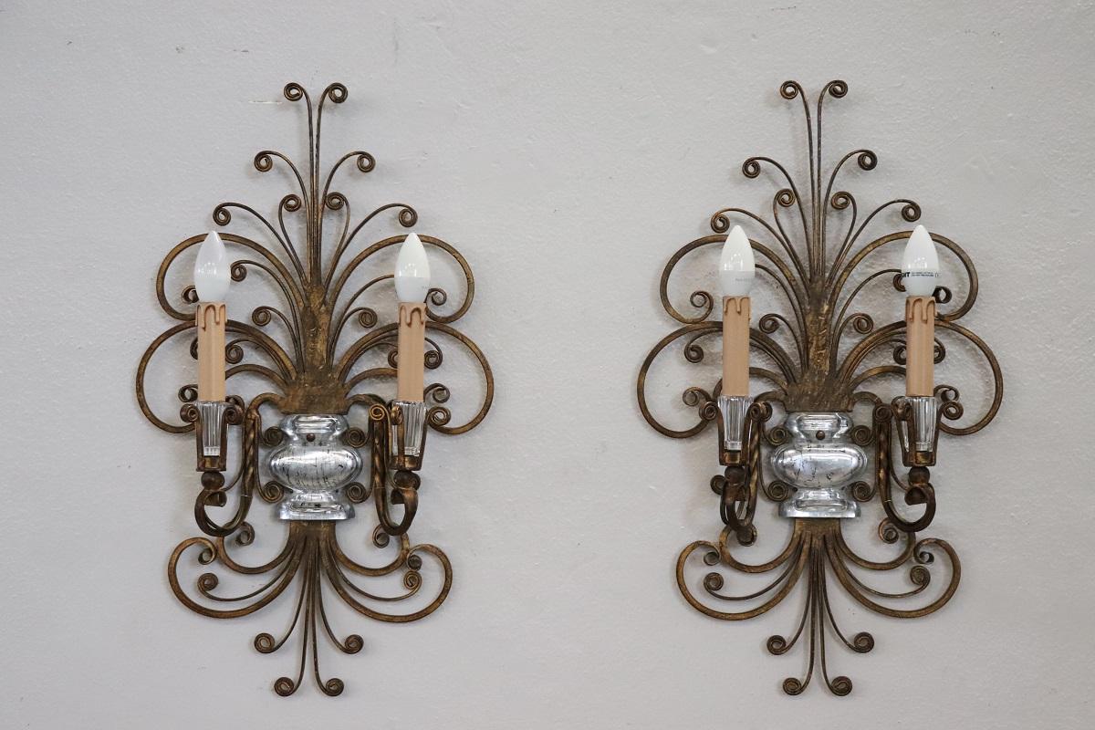 Gilt French Pair of Gilded Iron and Crystal Sconces by Maison Baguès, 1950s For Sale
