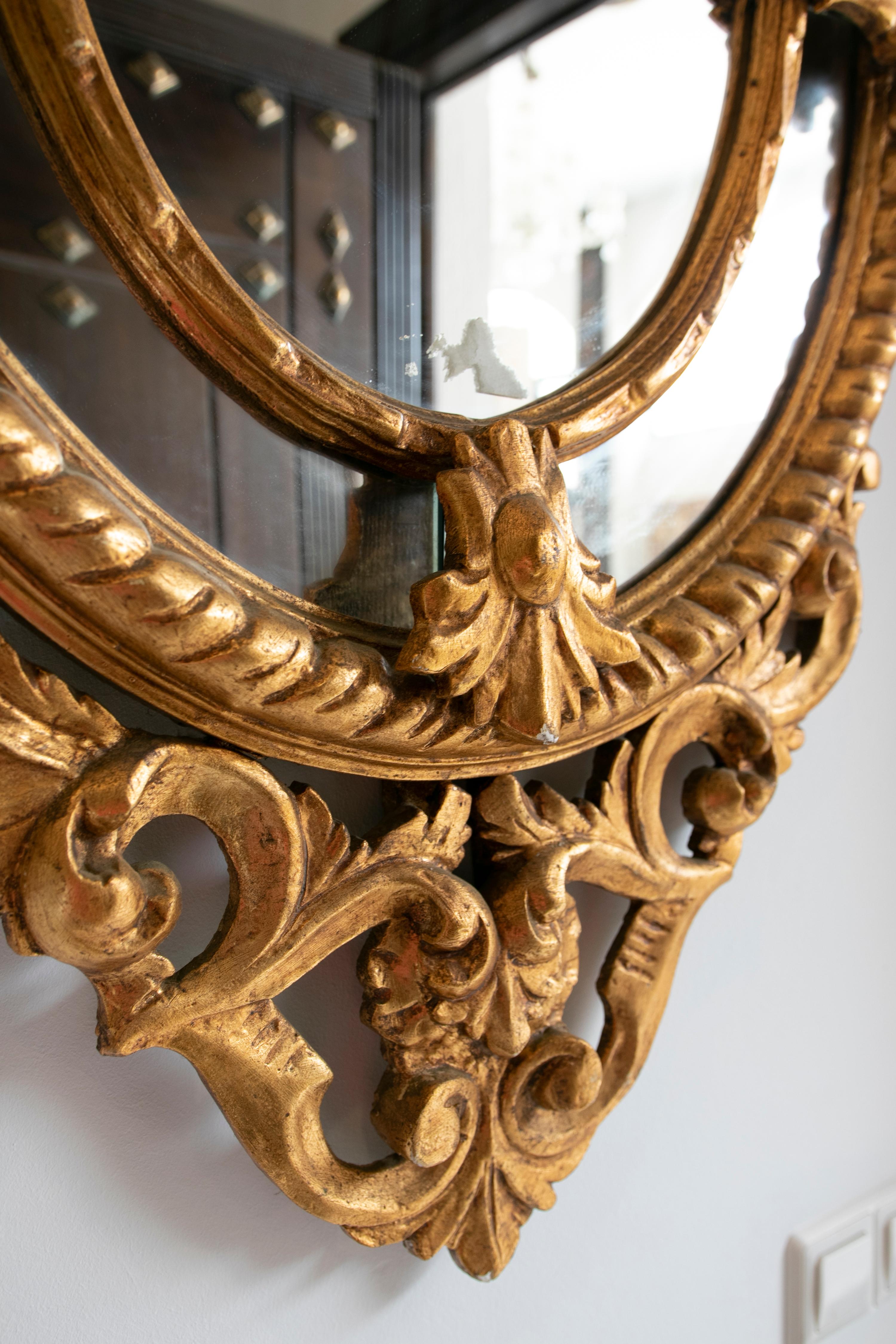 20th Century French Pair of Hand-Carved Oval-Shaped Gilded Mirrors For Sale