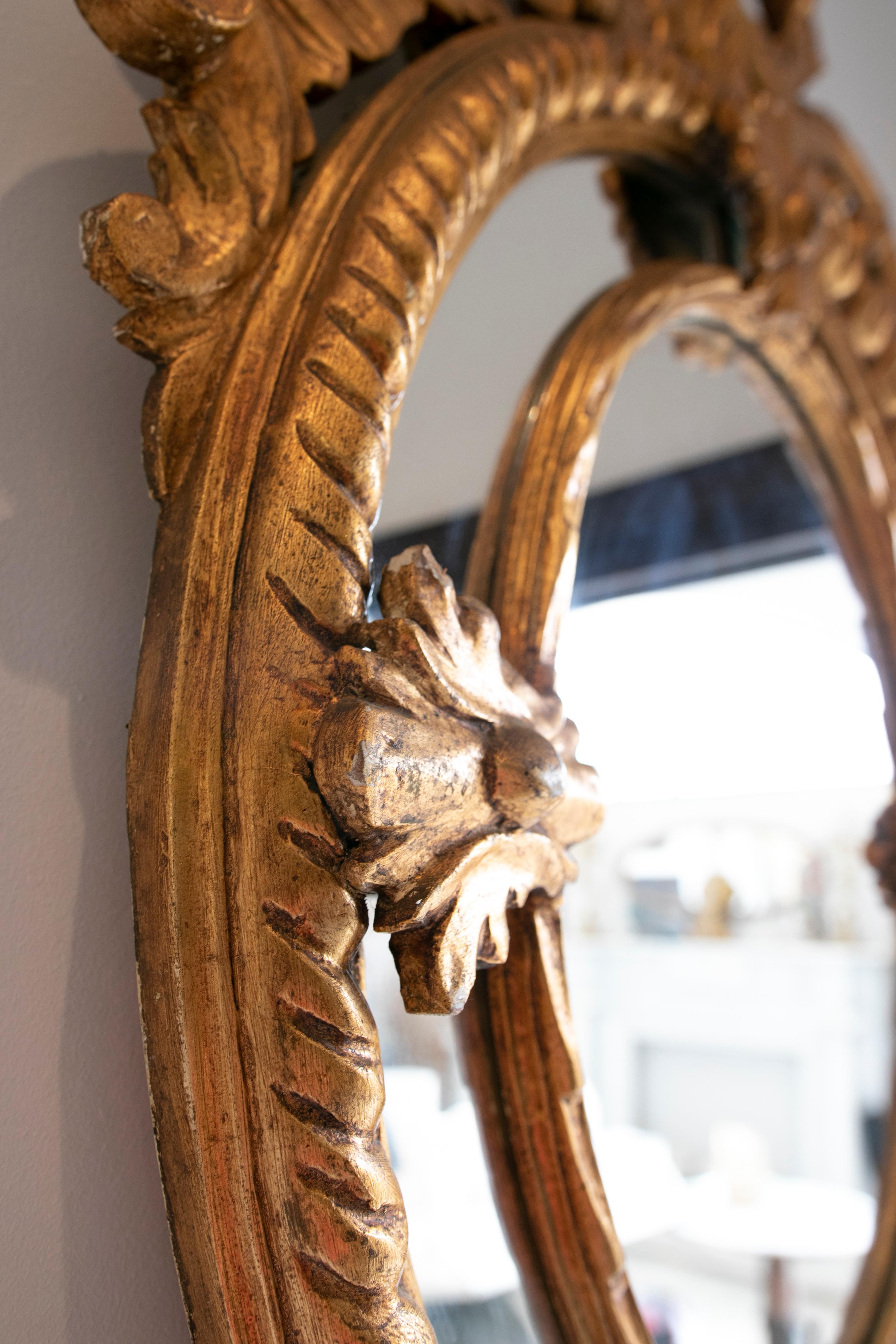 Wood French Pair of Hand-Carved Oval-Shaped Gilded Mirrors For Sale
