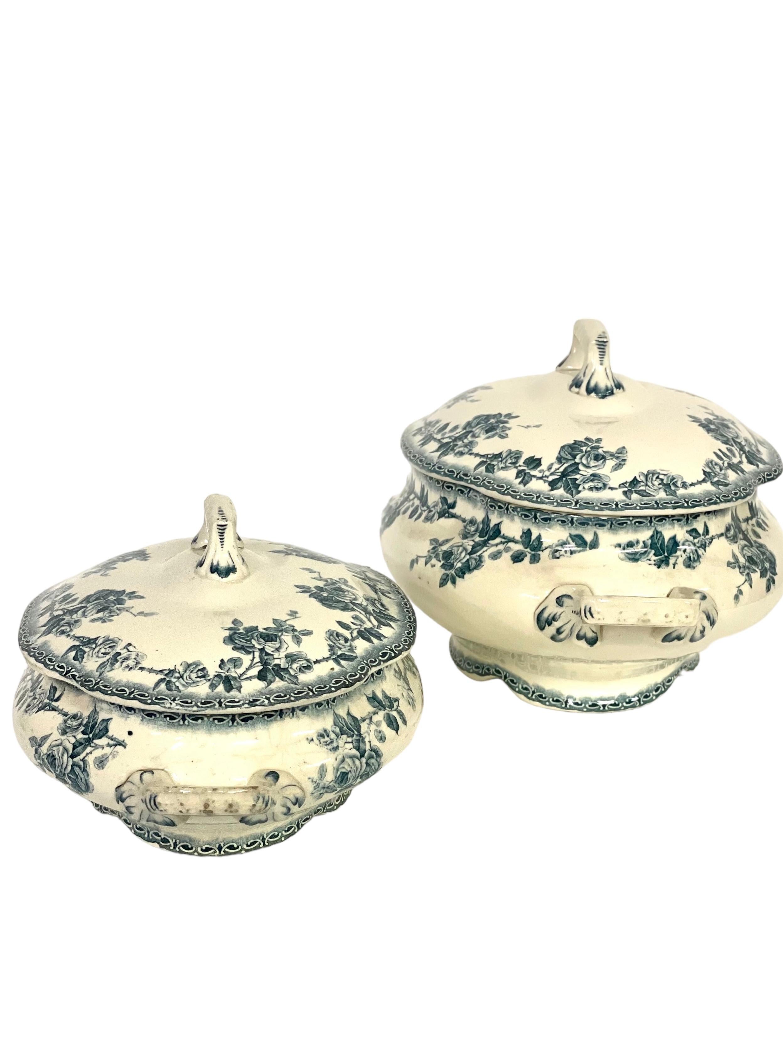 A splendid pair of antique French ironstone lidded soup tureens, or legumières, similar in design, although not identical. Once used for serving vegetables or soup at the dinner table, they are in good vintage used condition, nicely shaped and ivory