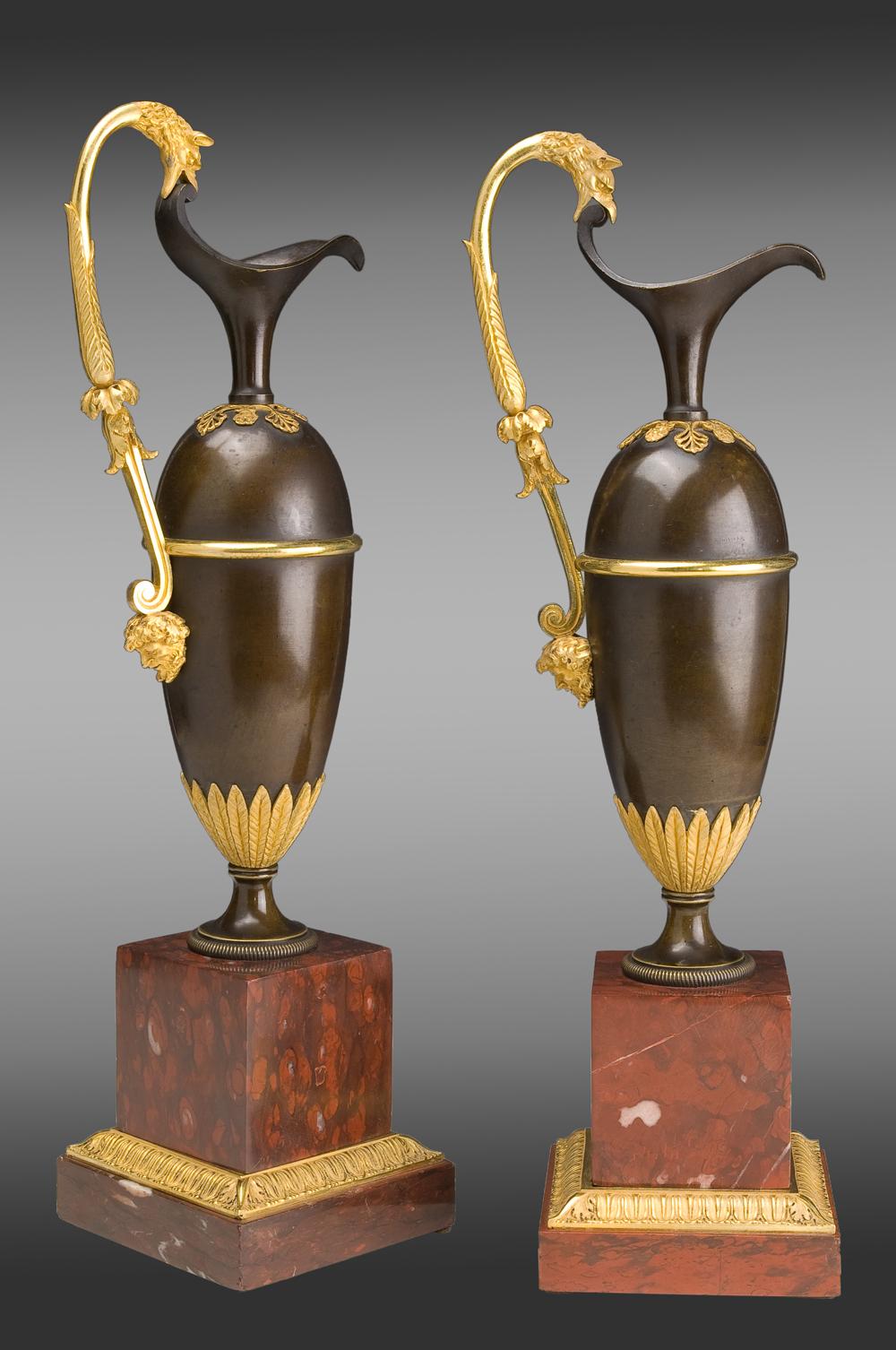 French pair of Jars in gilded and patinated bronze on a marble base red Campan
Model of A. Ravrio,
Early 19th century.