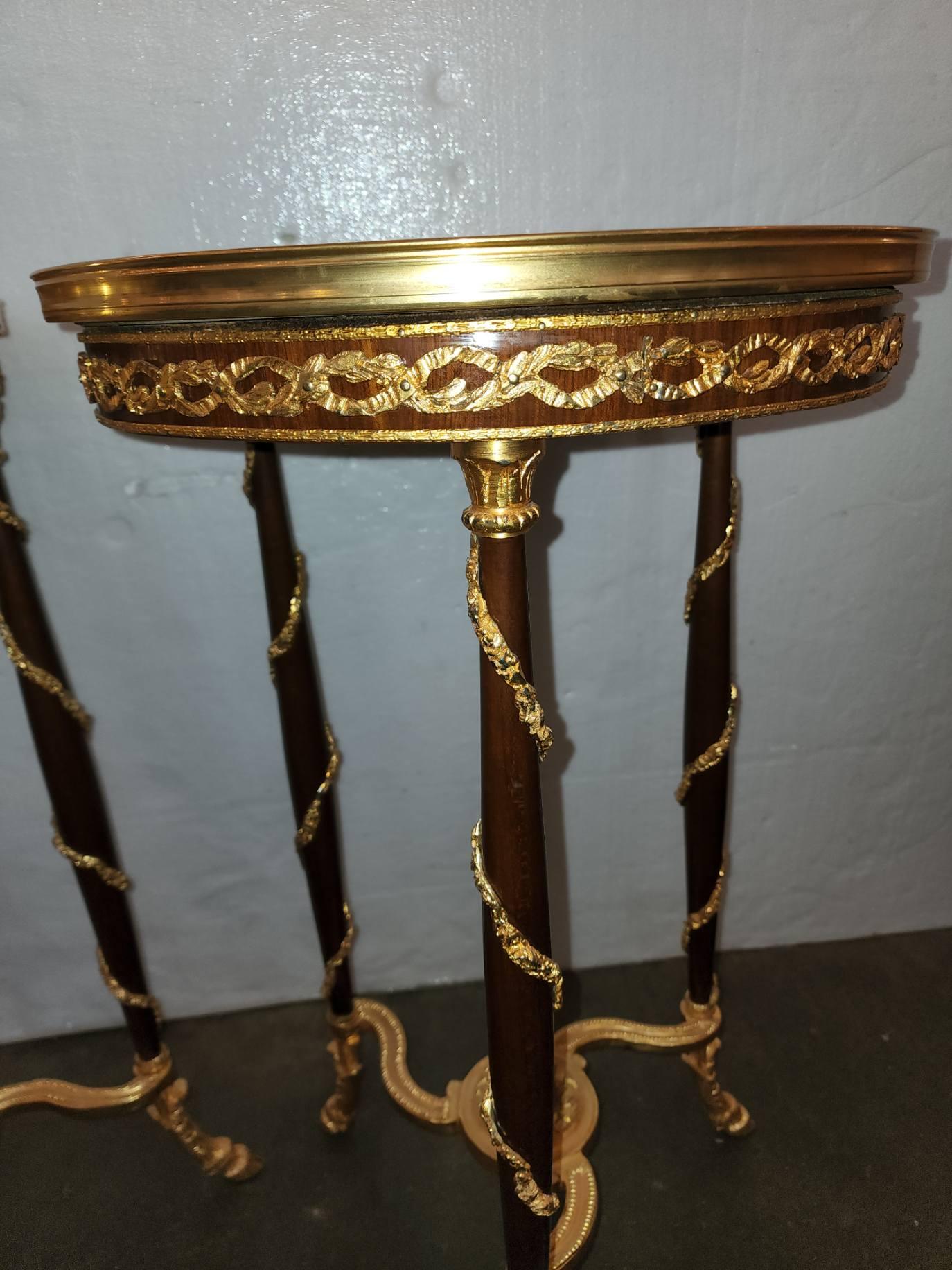 Pair Of French Marble Top Side Tables with bronze, hand carved and made of Mahogany, in excellent conditions 