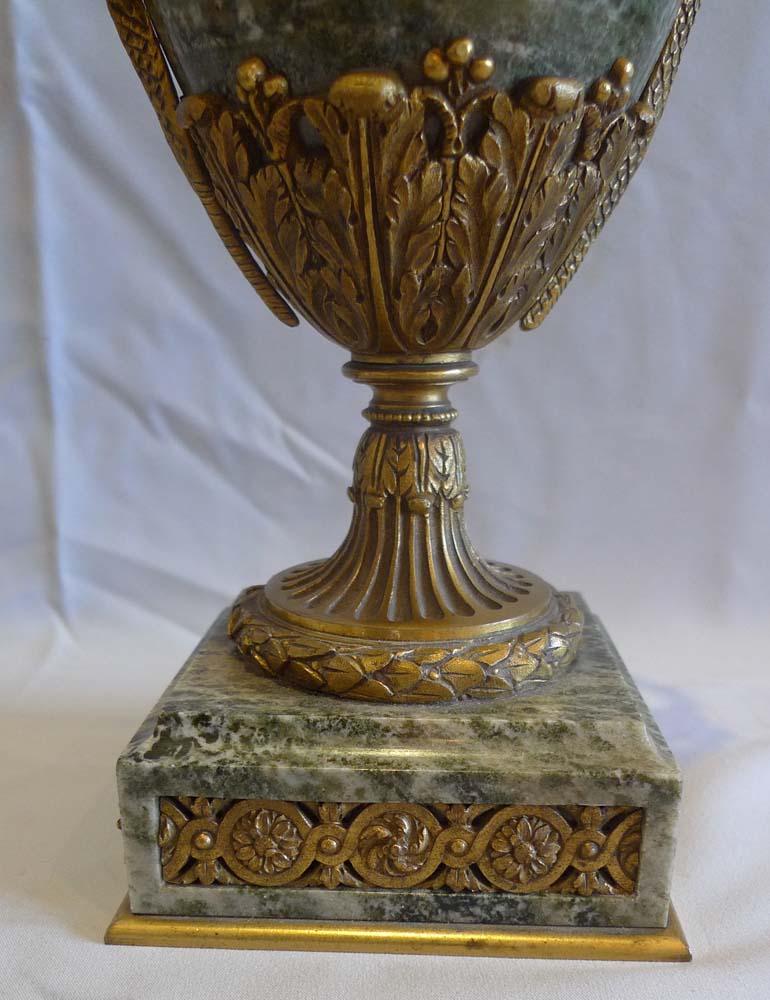Antique ormolu and marble lidded urns, Napoleon IIIrd period France. Fine and untouched condition with no damage to the marble and original ormolu to the mounts. Set on a shaped square marble base with four inset ormolu panels of Greek key and