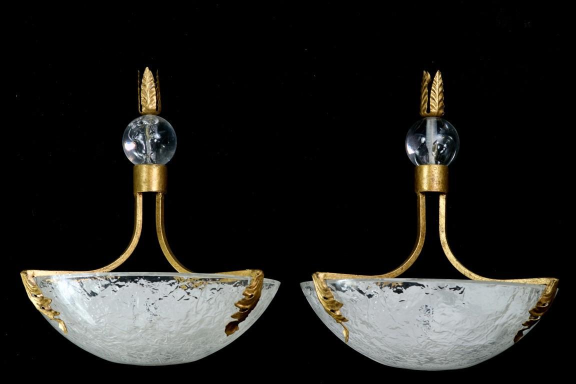 Pair of French style Mid-Century Modern sconces with textured Lucite shell shades. Gold painted frame done in a stylized floral leaf design. Cleaned and rewired. Please note, this item is located in our Scranton, PA location.
