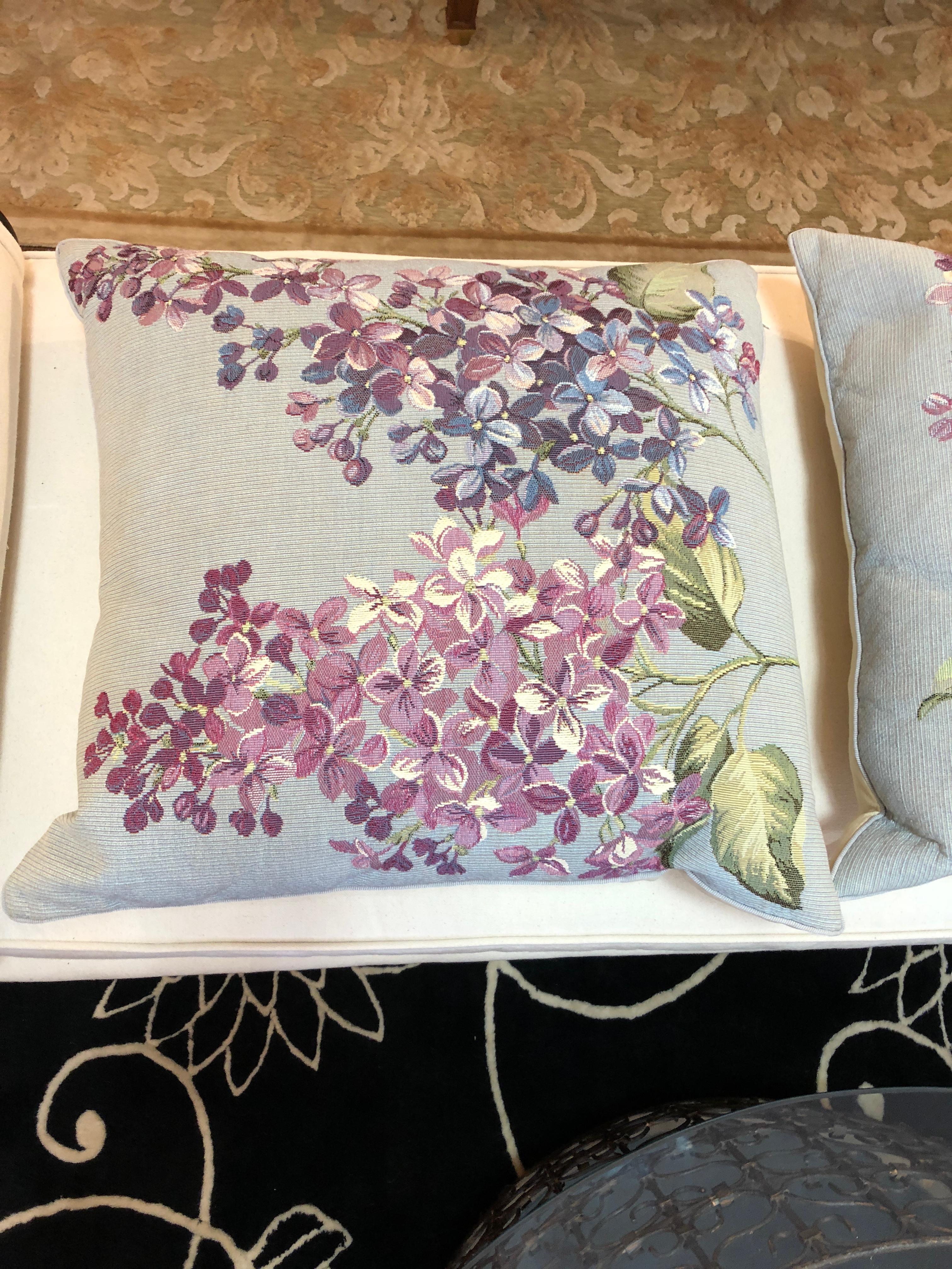 A pair of lovely tapestry pillows in gorgeous blues, purples and mauve having lilacs and a butterfly. Insert is down filled. Label is Iosis, Paris.