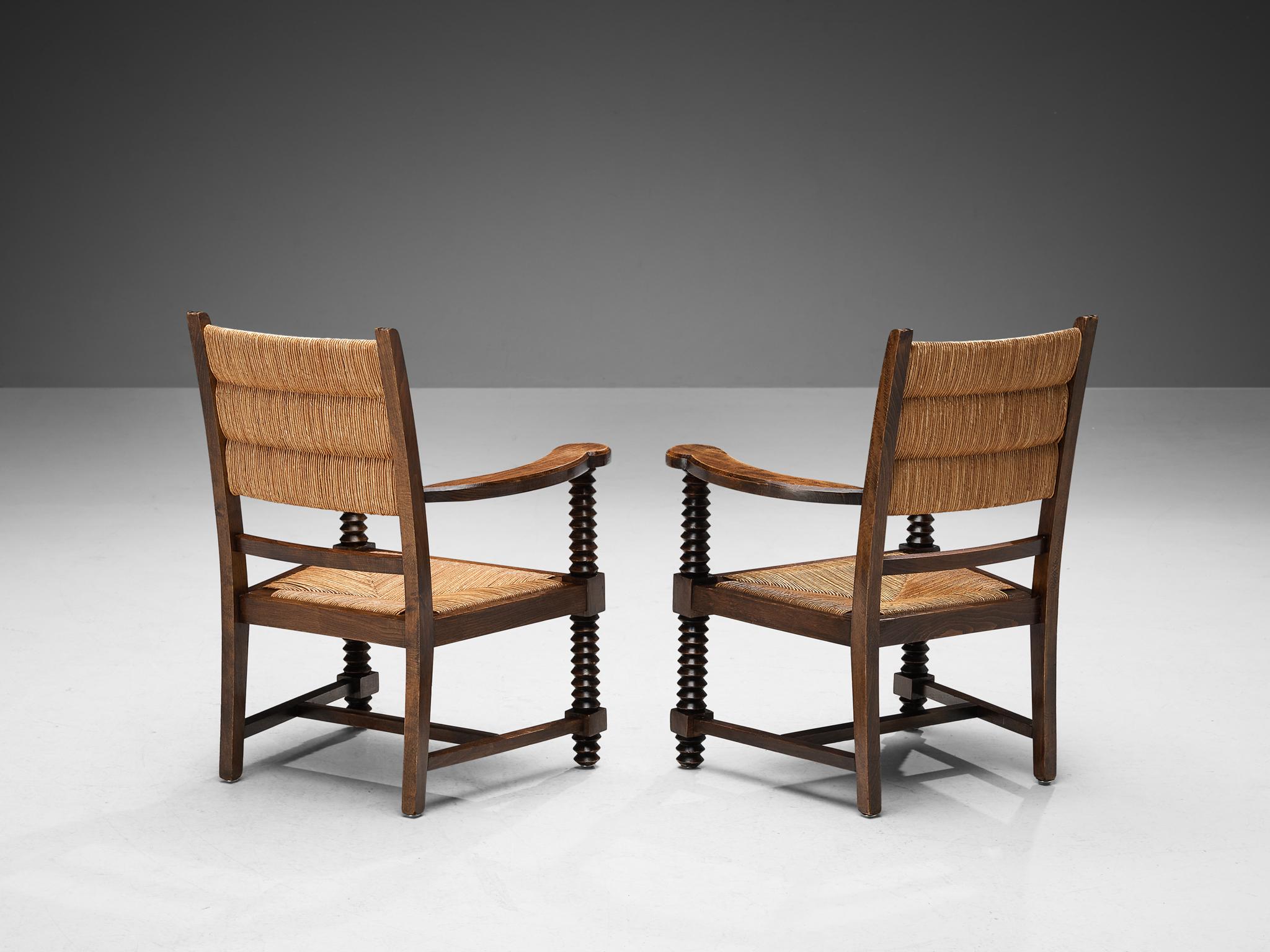 Pair of lounge chairs, straw, stained wood, France, 1940s

This piece of furniture embodies an evolved provincial character with great quality of elegance. The sincere construction and type of upholstery, give the chair a character of its own. The