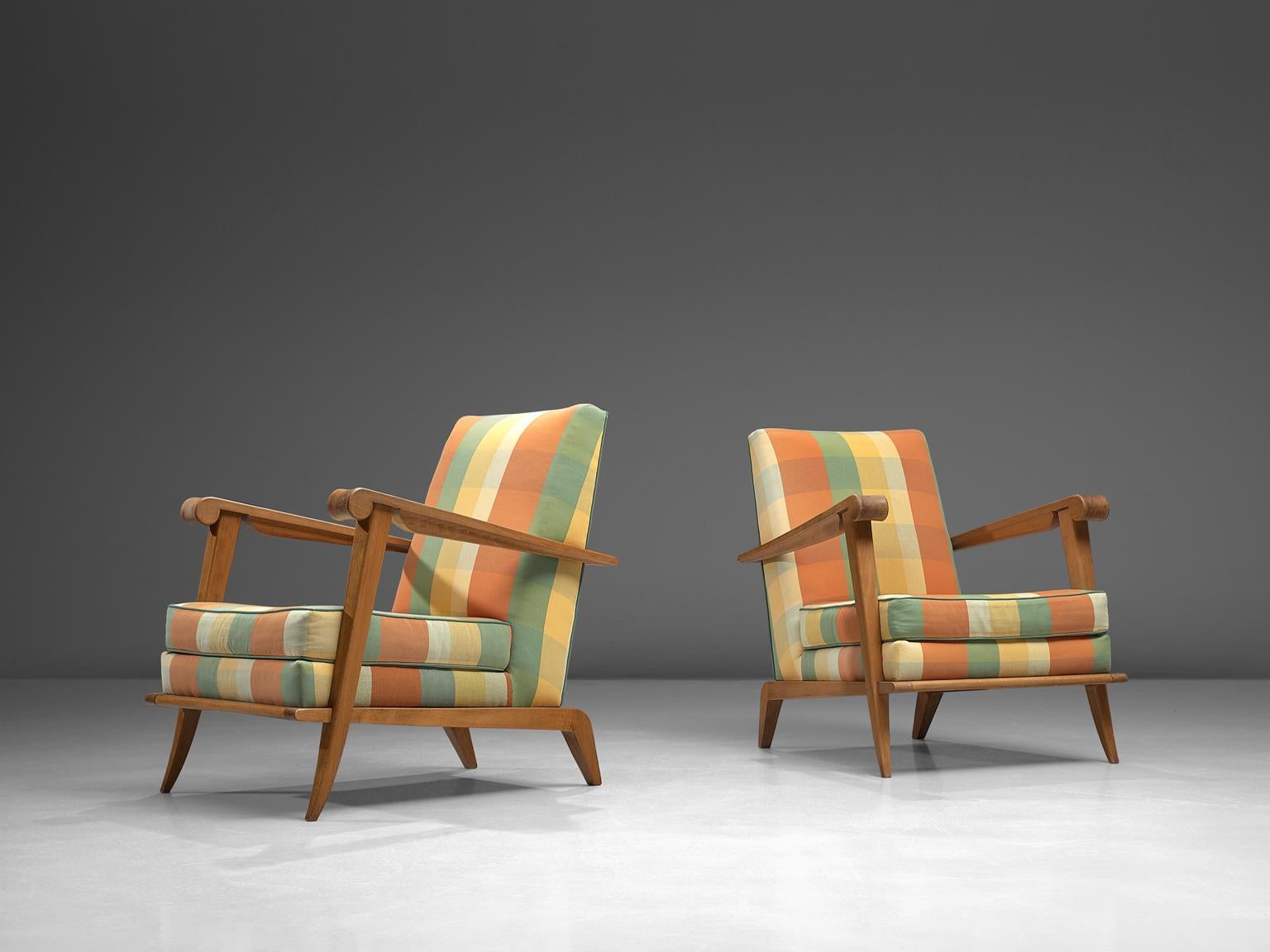 Pair of lounge chairs, oak, fabric, France, 1950s

Outstanding set of lounge chairs have a striped/ blocked upholstery with a solid oak sculptural frame. The chairs are finished with an additional cushion in the seat for extra comfort. The rounded