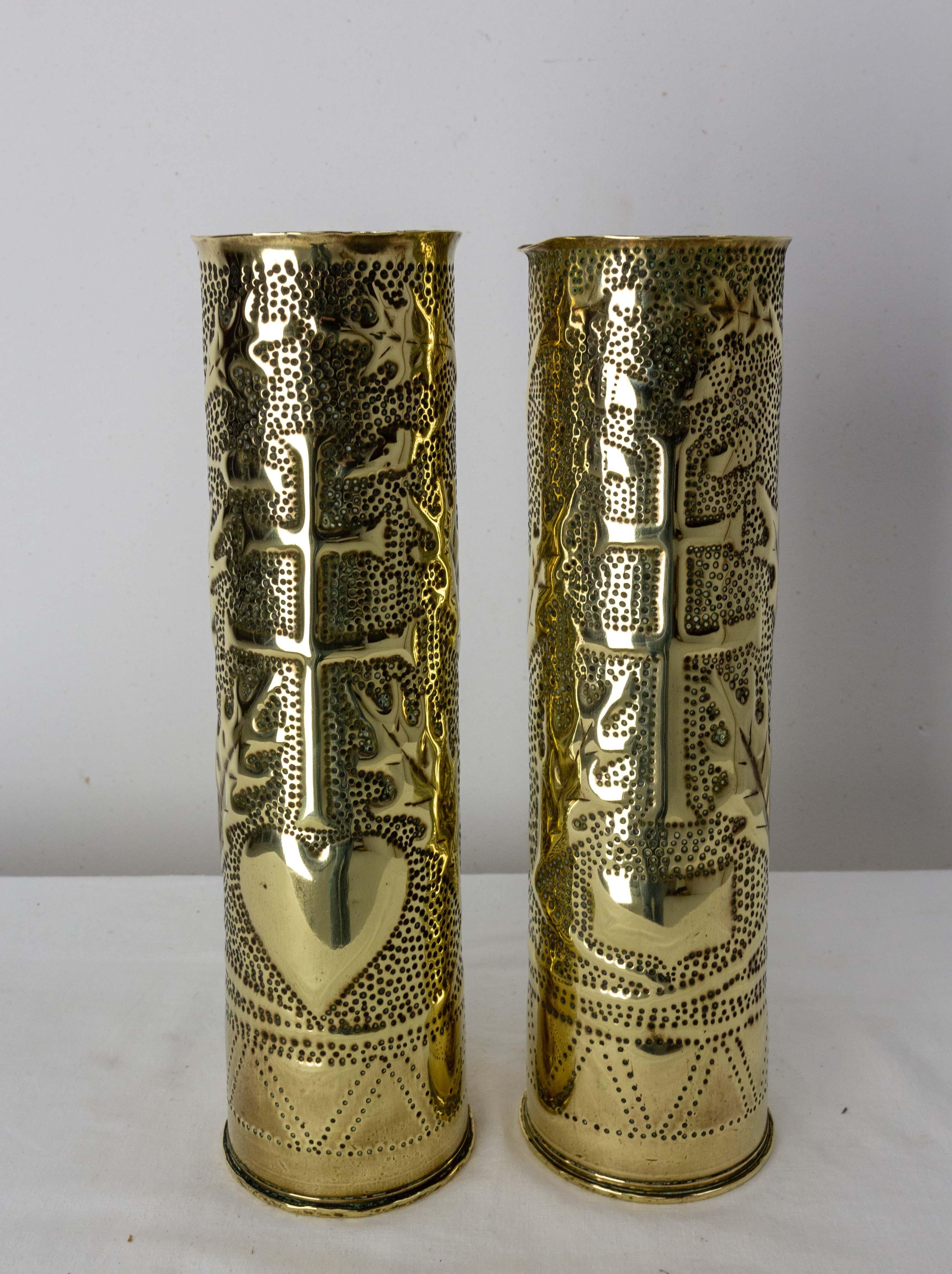 Antique French Pair of Shell Casings from the World War I
Trench Artillery
Brass engraved representing on each casing A Lorraine cross and leaves. On one there is a heart under the Lorraine cross, on the other there is a blazon.
This pair can