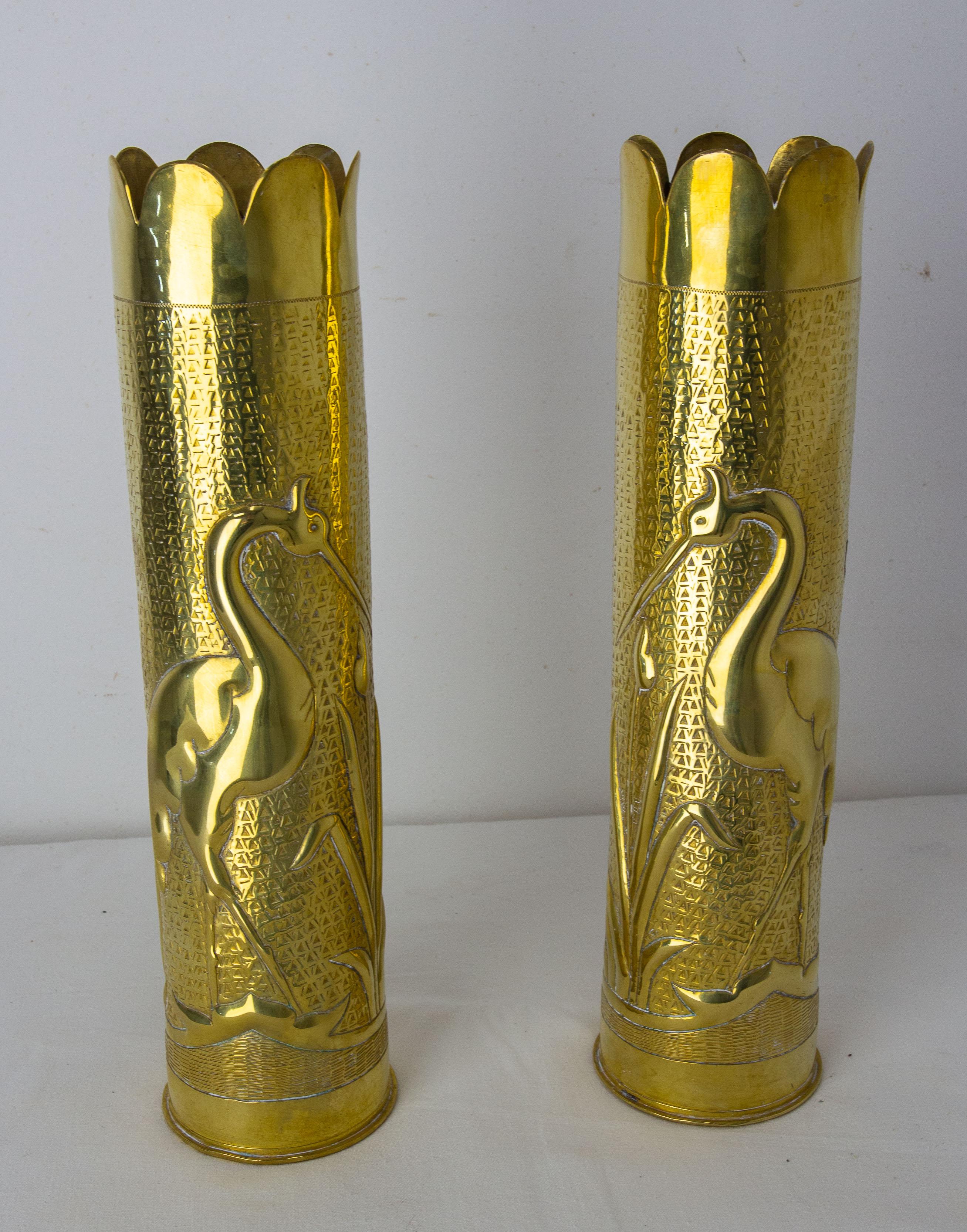 Antique French pair of shell casings from the World War I.
Trench Artillery
Brass engraved representing a heron in a pond surrounded by rushes on each casing.
A crack in one of the sockets nothing disturbing (please see photo)
Good