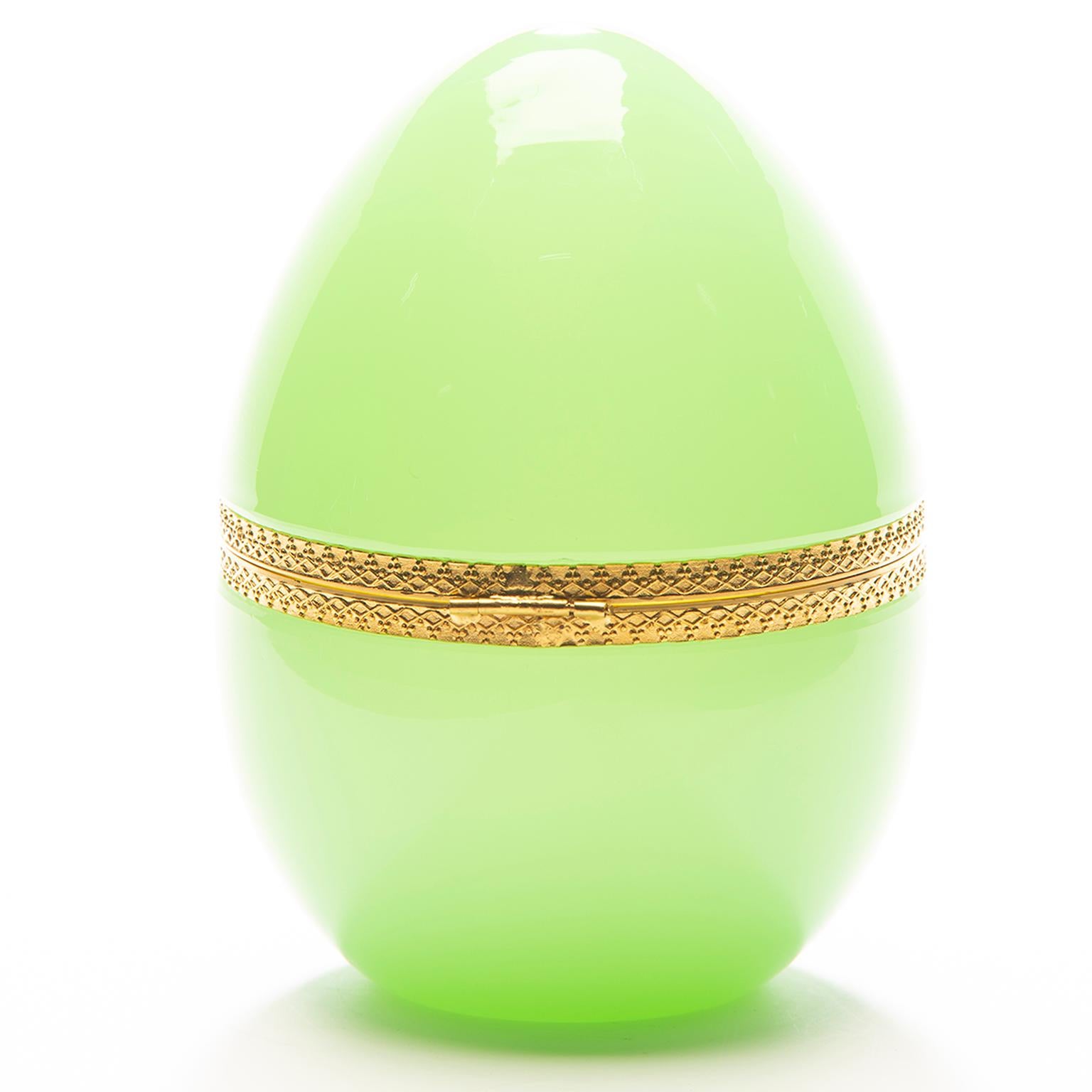 Pale green French opaline glass keepsake box is egg-shaped with a hinged lid and brass trim. Excellent vintage condition, circa 1930s.