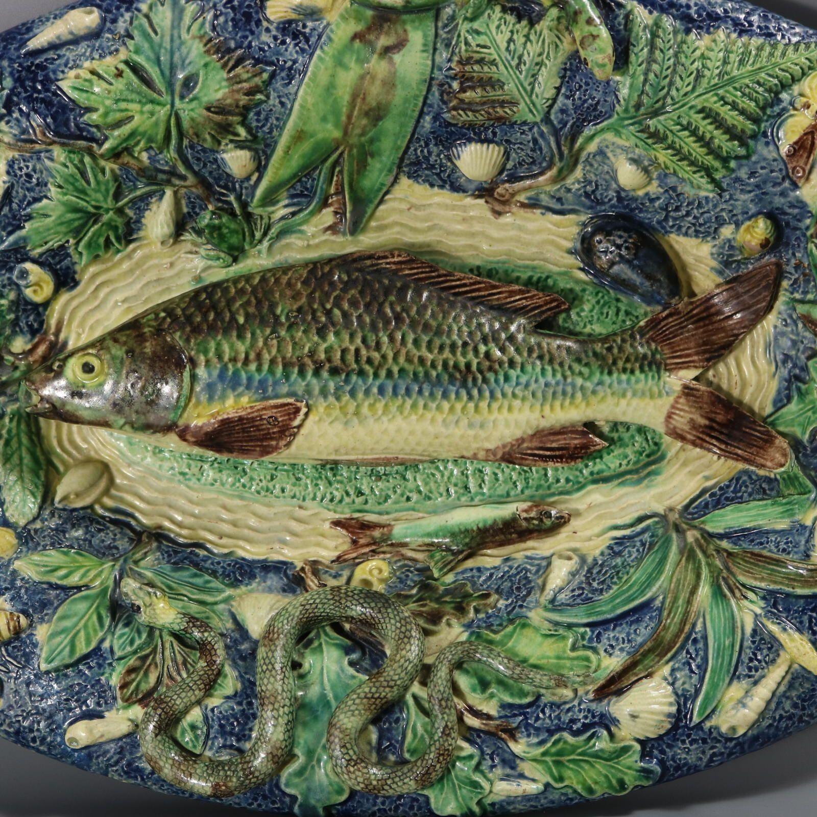 Unidentified French French Palissy Majolica wall platter which features a fish (carp), a snake, a frog, a lizard, shellfish, insects and leaves. Ripple effect ground. Colouration: green, blue, brown, are predominant. Book reference, similar piece