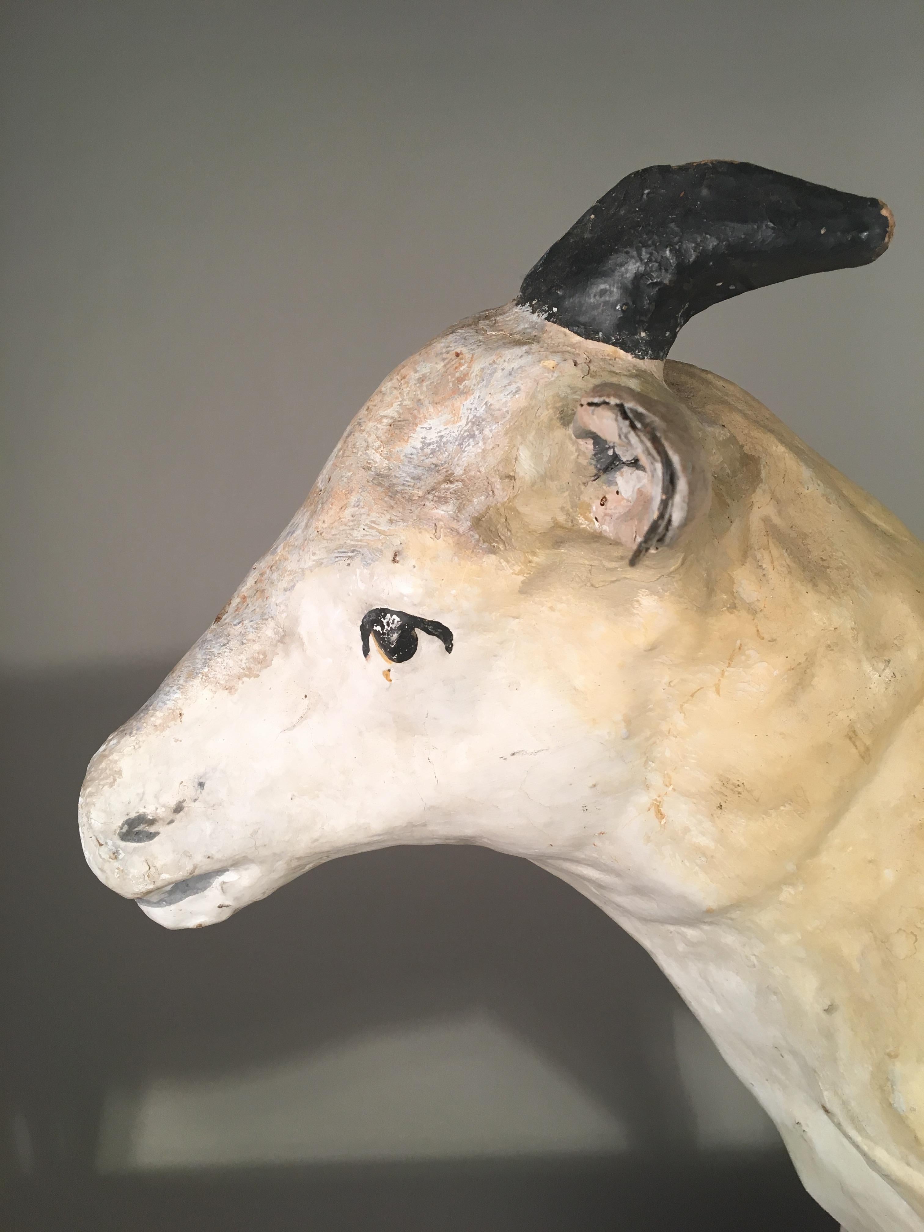 A French Folk Art papier mâché goat figure, either a toy or a creche figure, 19th century.