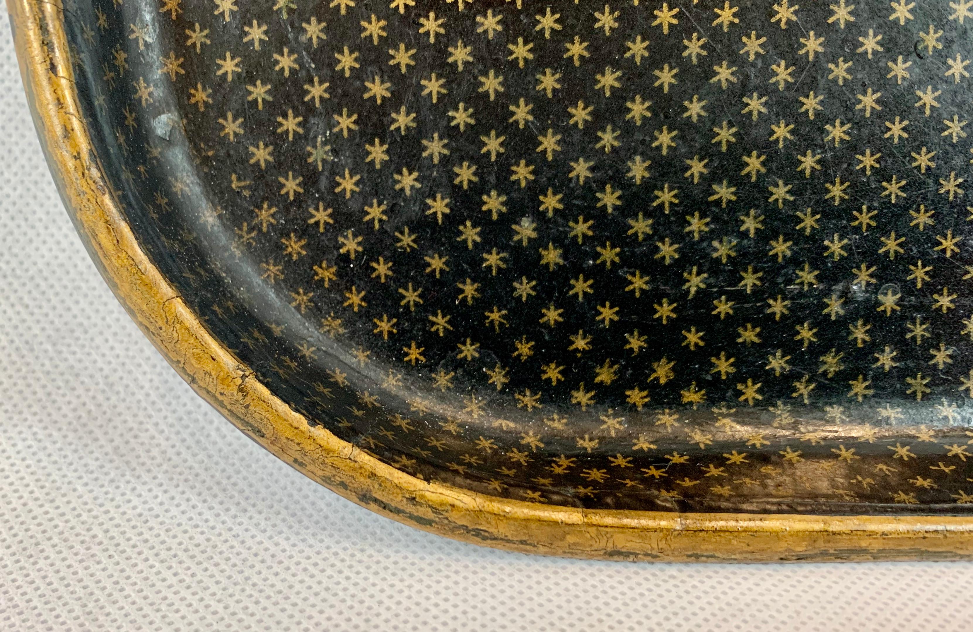 French papier-mâché rectangular tray with rounded corners in the gold star pattern that was so popular during the Napoleon III period. These trays were originally referred to as tea trays, but of course today the choice of use is up to you. In very
