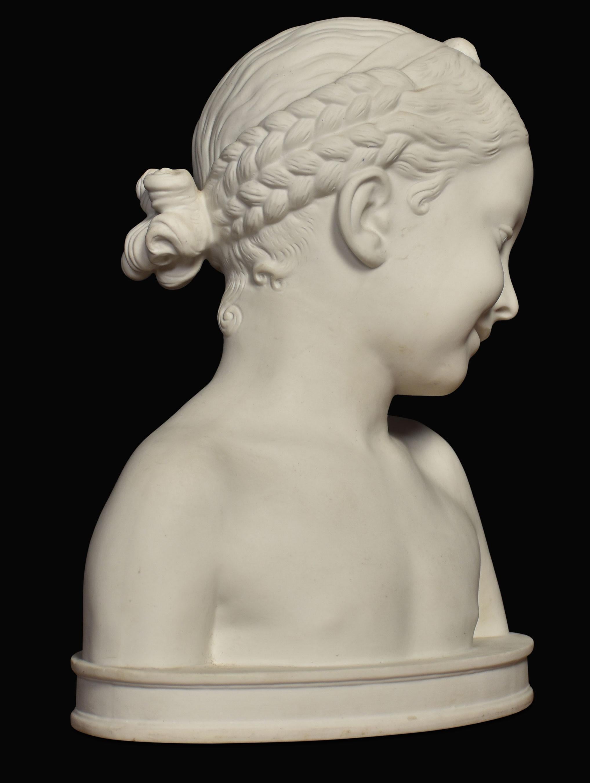 19th-century French parianware bust of a young girl After Jean-Baptiste Pigalle.
Dimensions
Height 11.5 inches
Width 9.5 inches
Depth 7 inches.