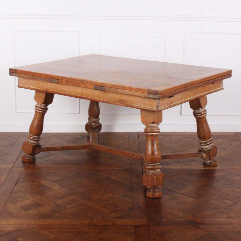 A French draw-leaf dining table in cherry and elm with a parquet top and splayed turned legs, circa 1920.

55 inches Wide x 39 inches Deep x 29.5 inches Tall x 2 x 21 inches leaves.