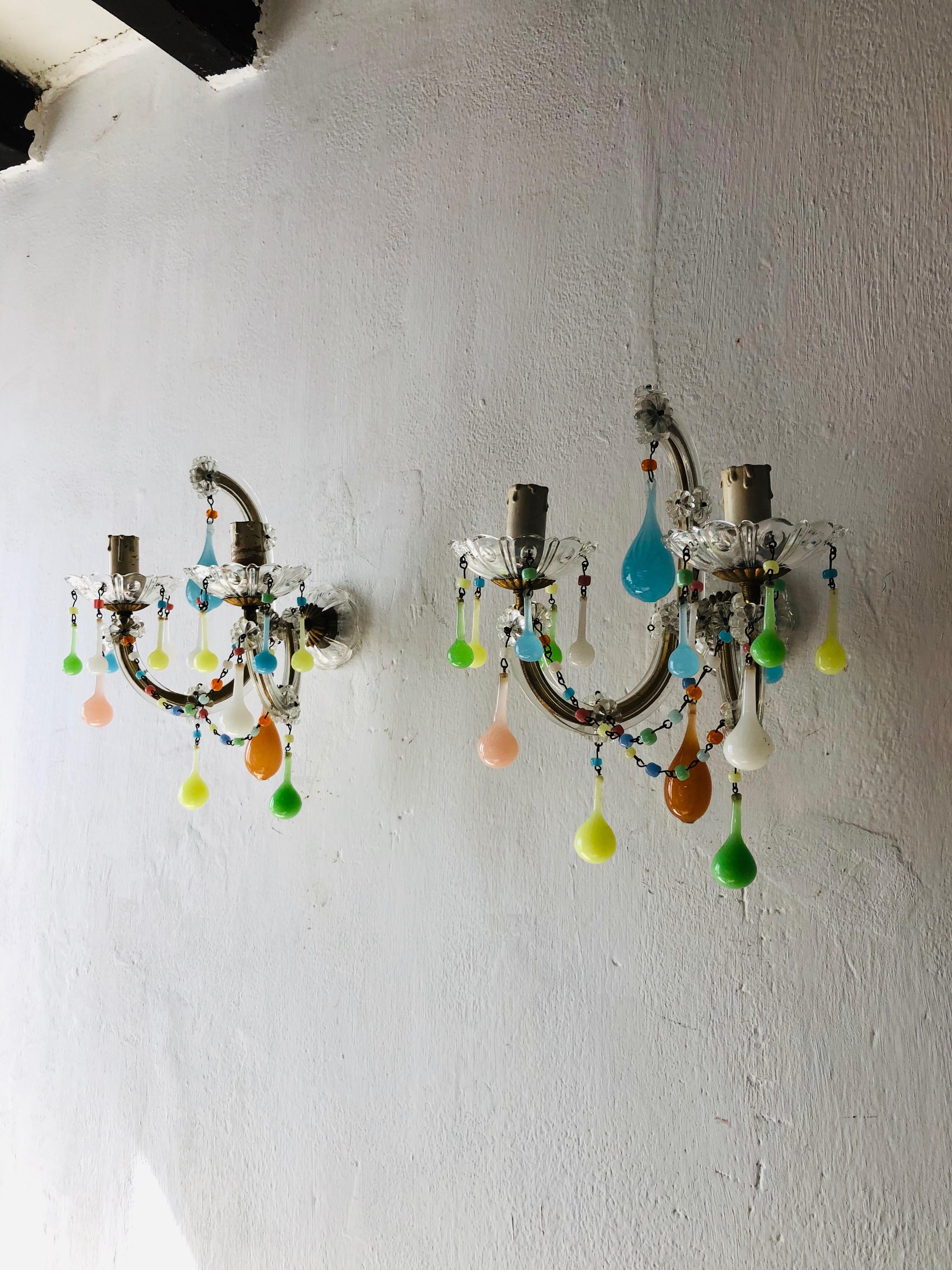 Re-wired and ready to hang! Housing two lights each, sitting in crystal bobeches dripping with pastel beads and opaline drops. Adorning big opaline drops as well. Free priority UPS shipping from Italy.
