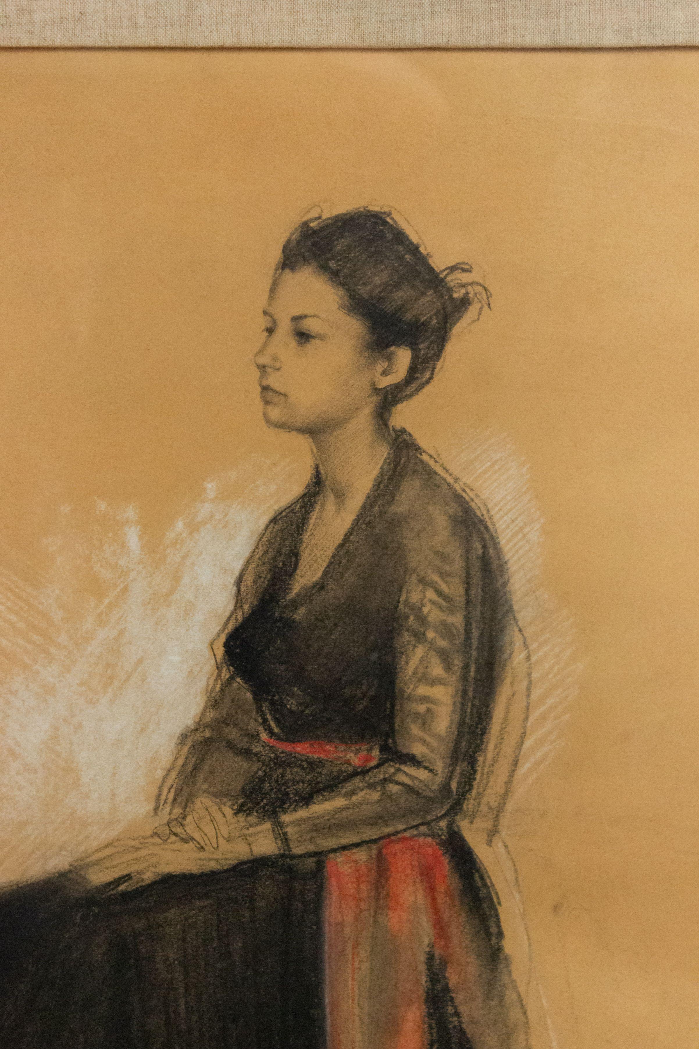 French (1st half 20th Cent) pastel painted of a seated lady in a black dress with a red sash (signed).
 