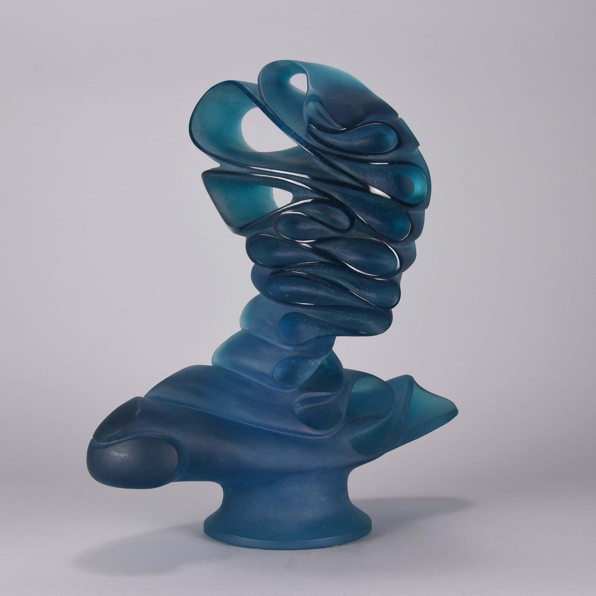 Captivating limited edition French pate-de-verre glass abstract study of a female bust designed by Jean Faucheur and created by Daum Glassworks. The bust with translucent blue color and clean surface detail. Numbered 122/275, signed Daum France &