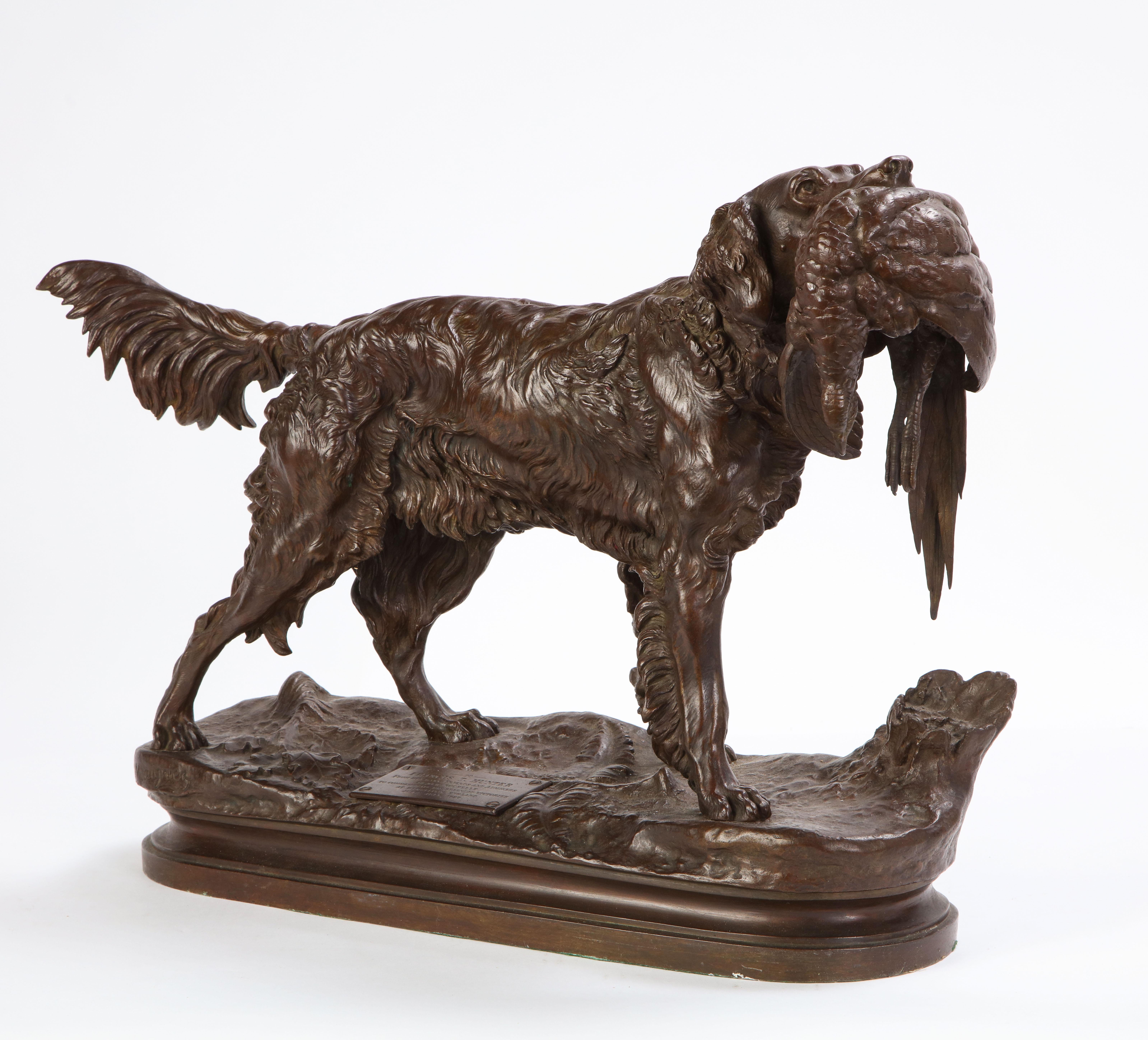 French patinated bronze model of a dog, late 19th early 20th century, cast after a model by Jules Moignier. An applied presentation plaque reads: 'TO / FRANCIS T. HUNTER / FROM HIS MANY FRIENDS AND ADMIRERS / IN NEW ROCHELLE / TO COMMEMORATE HUS