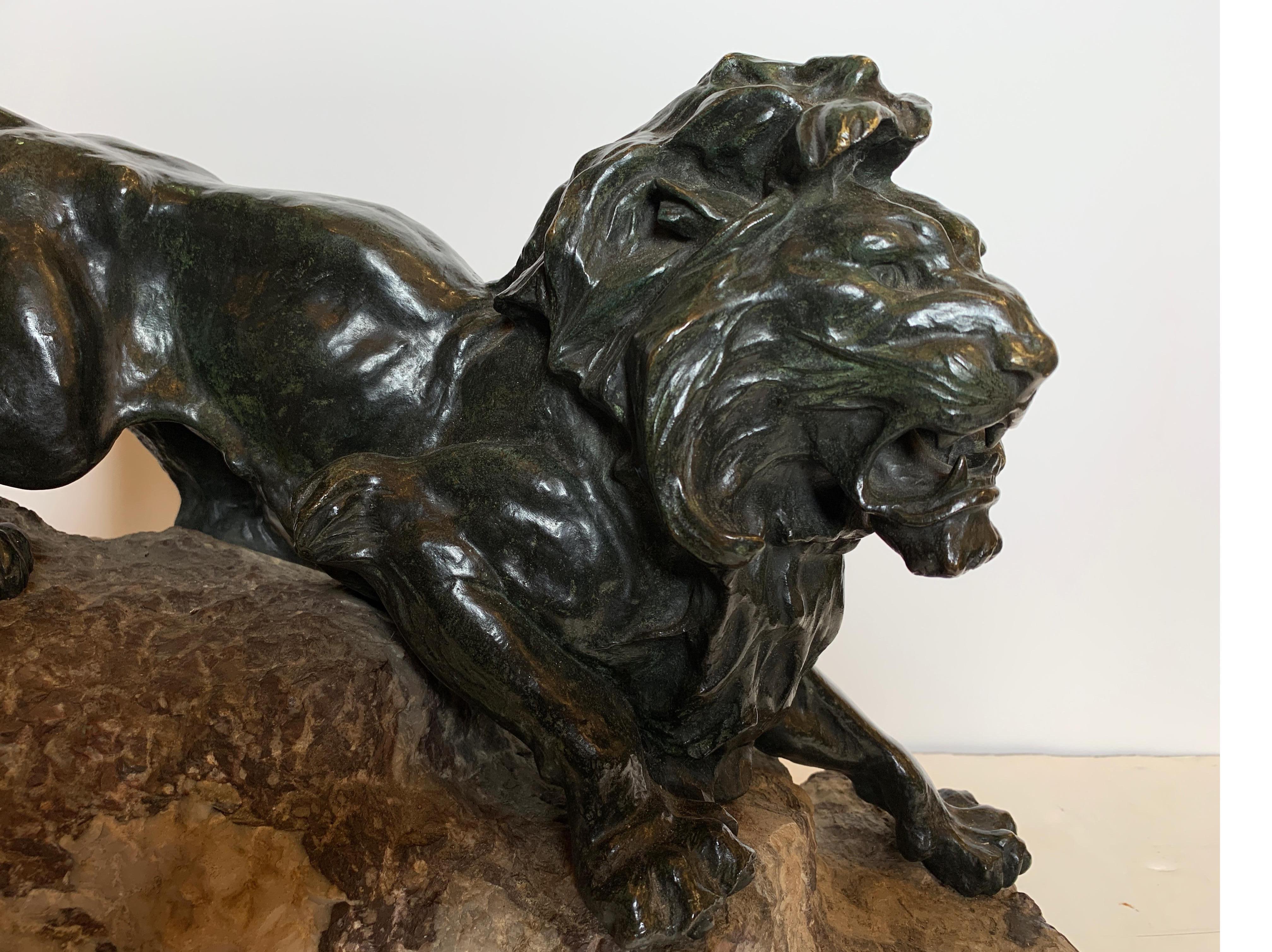 Early 20th Century French Patinated Bronze Figure of a Lion on Rock Base
