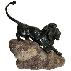 French Patinated Bronze Figure of a Lion on Rock Base