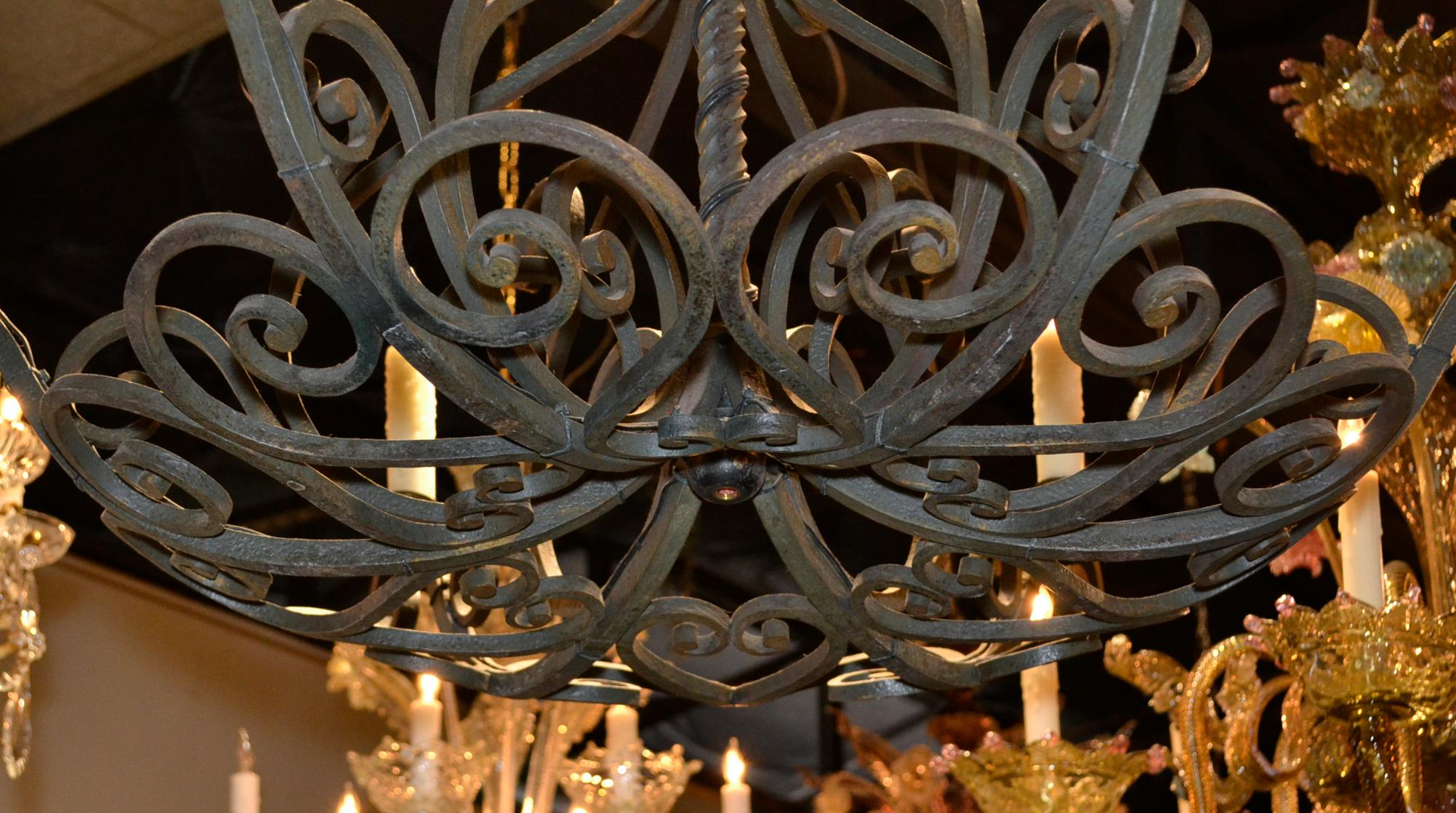 Charming antique French patinated iron 6-arm chandelier.
