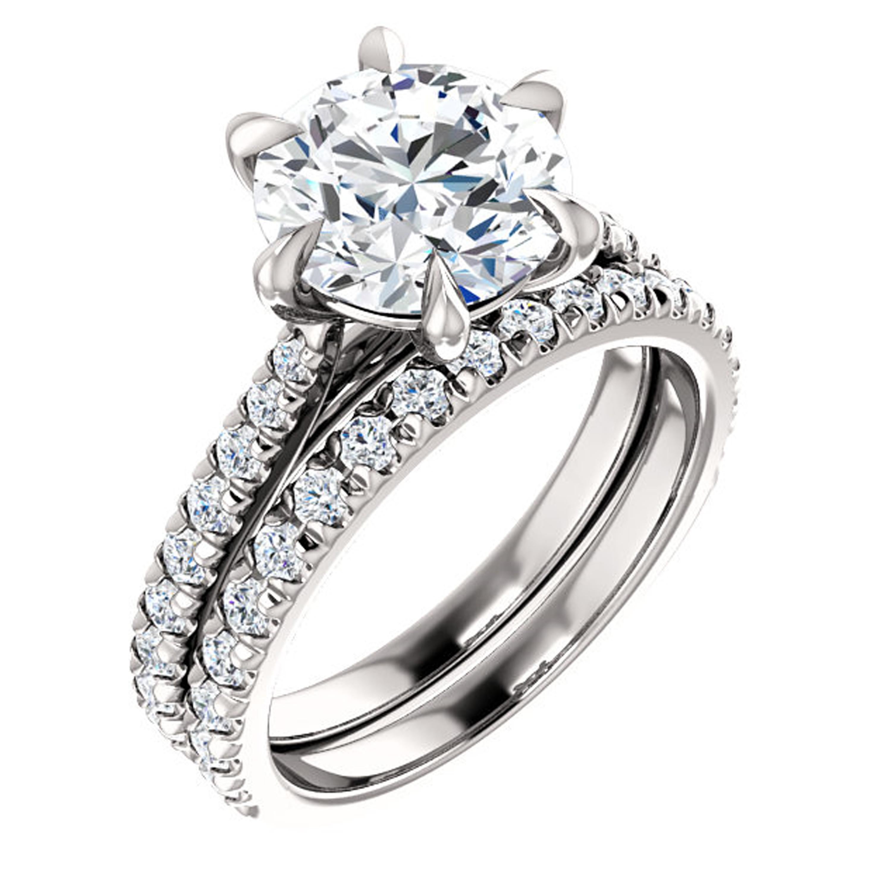 Gorgeous french pavé diamonds adorn the shank of this claw prong engagement ring. French setting allows breathtaking amount of light entering each diamond. Closely set with exposed sides, french pave setting creates maximum shine and brilliance.