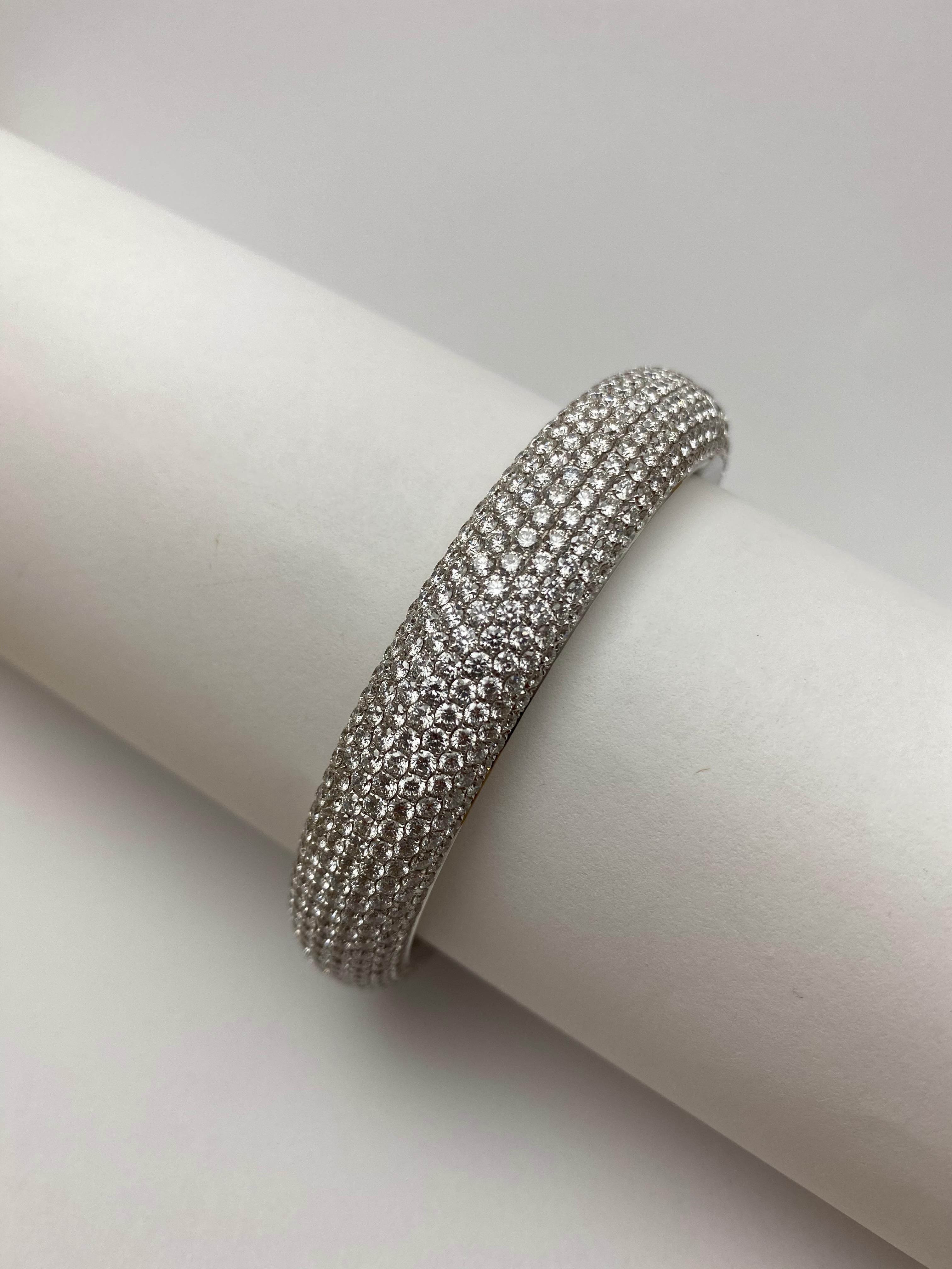 Made in France, this bangle is expertly set with over 25cts of bright, white diamonds.  It is as appropriate for an elegant event as it is for a chic soiree and this versatile jewel will bring joy to the wearer for years to come.  The unique