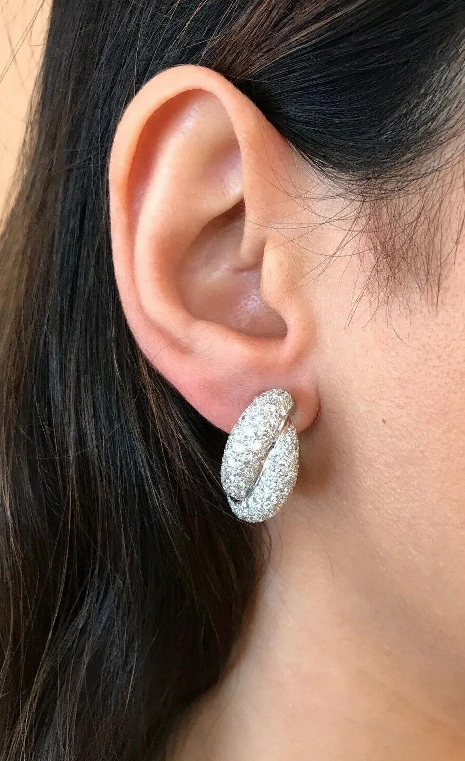 French made Pavé Diamond Twist Earrings in 18k White Gold

Double Row Pavé Twist Earrings feature 4.48 carats of Round Brilliant Diamonds Pavé set in 18k White Gold. The earrings are clip-on style for non-pierced ears.

Total diamond weight is 4.48