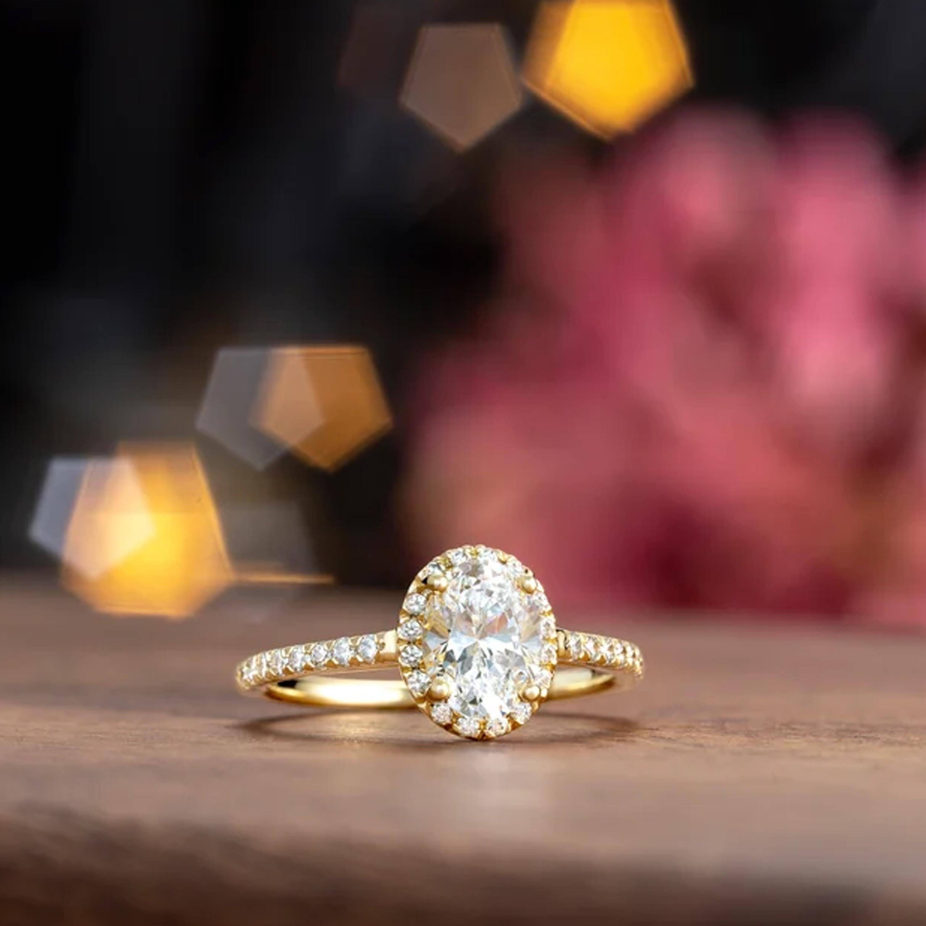 Closely set together with exposed sides, the French pave diamonds are exposed to maximum light exposure. Shimmering natural white diamonds surround the halo and with maximum brilliance amplify the GIA certified center oval diamond. Additional
