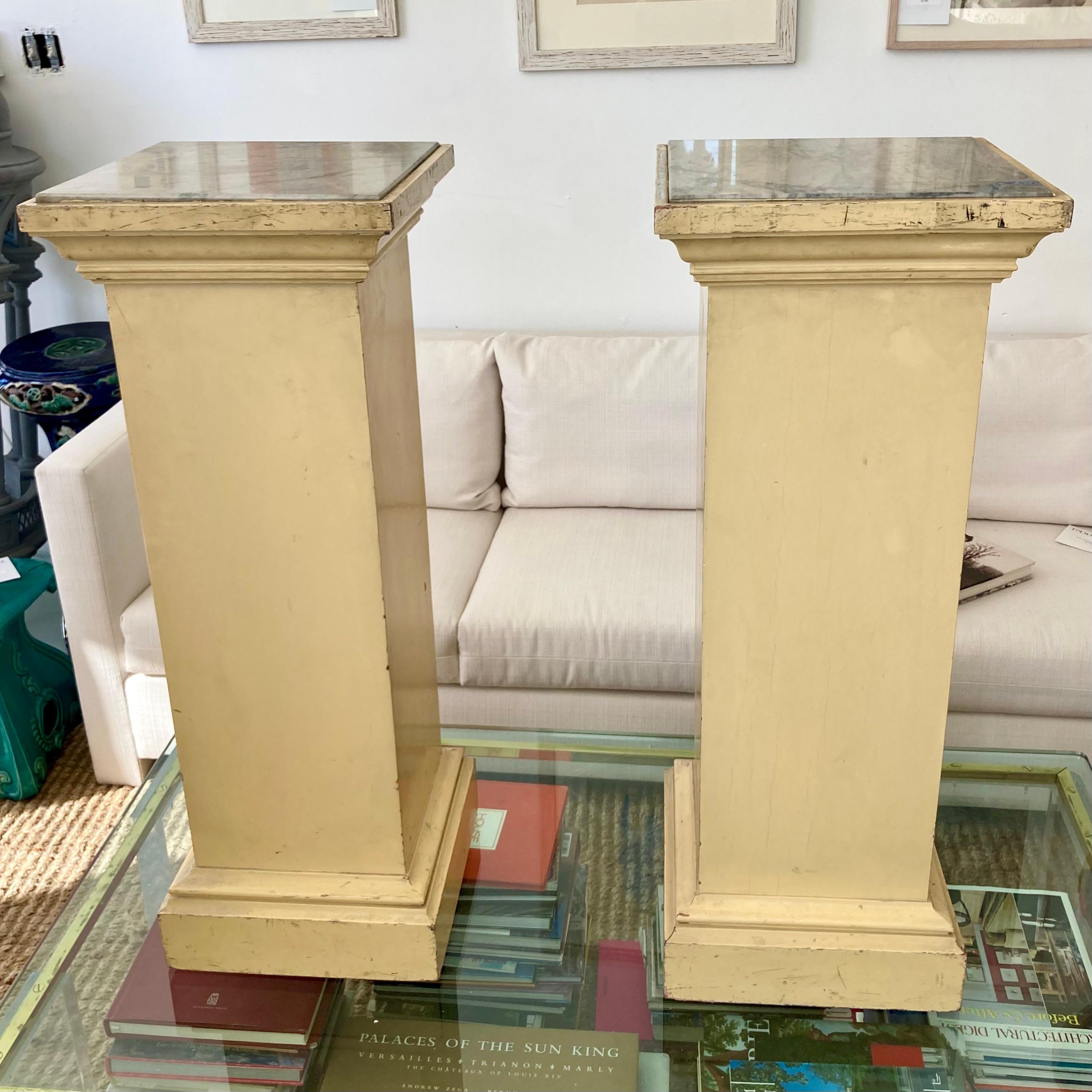 Beautiful pair of French pedestals with marble tops. Great addition to your architectural French inspired home and interiors.