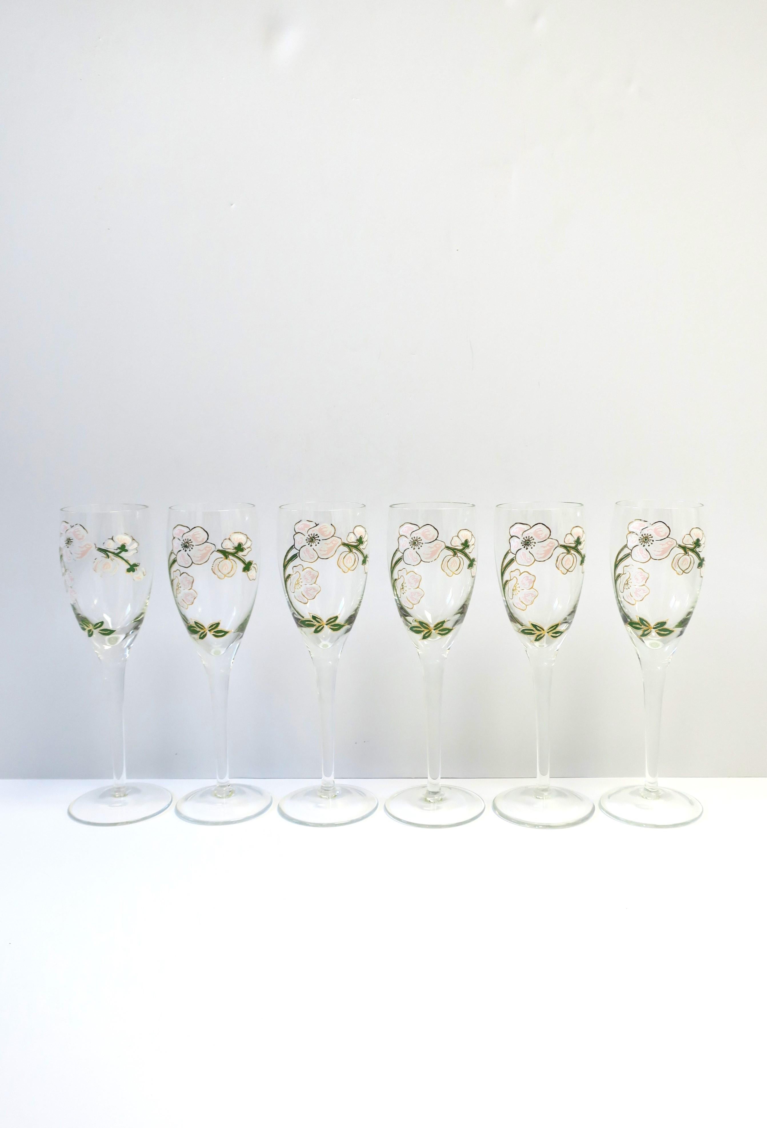 A beautiful set of six (6) vintage Perrier-Jouet French champagne flute glasses with iconic floral motif in the Art Nouveau style, circa mid to late-20th century, France. This iconic floral design of Japanese pink anemone flowers is from French