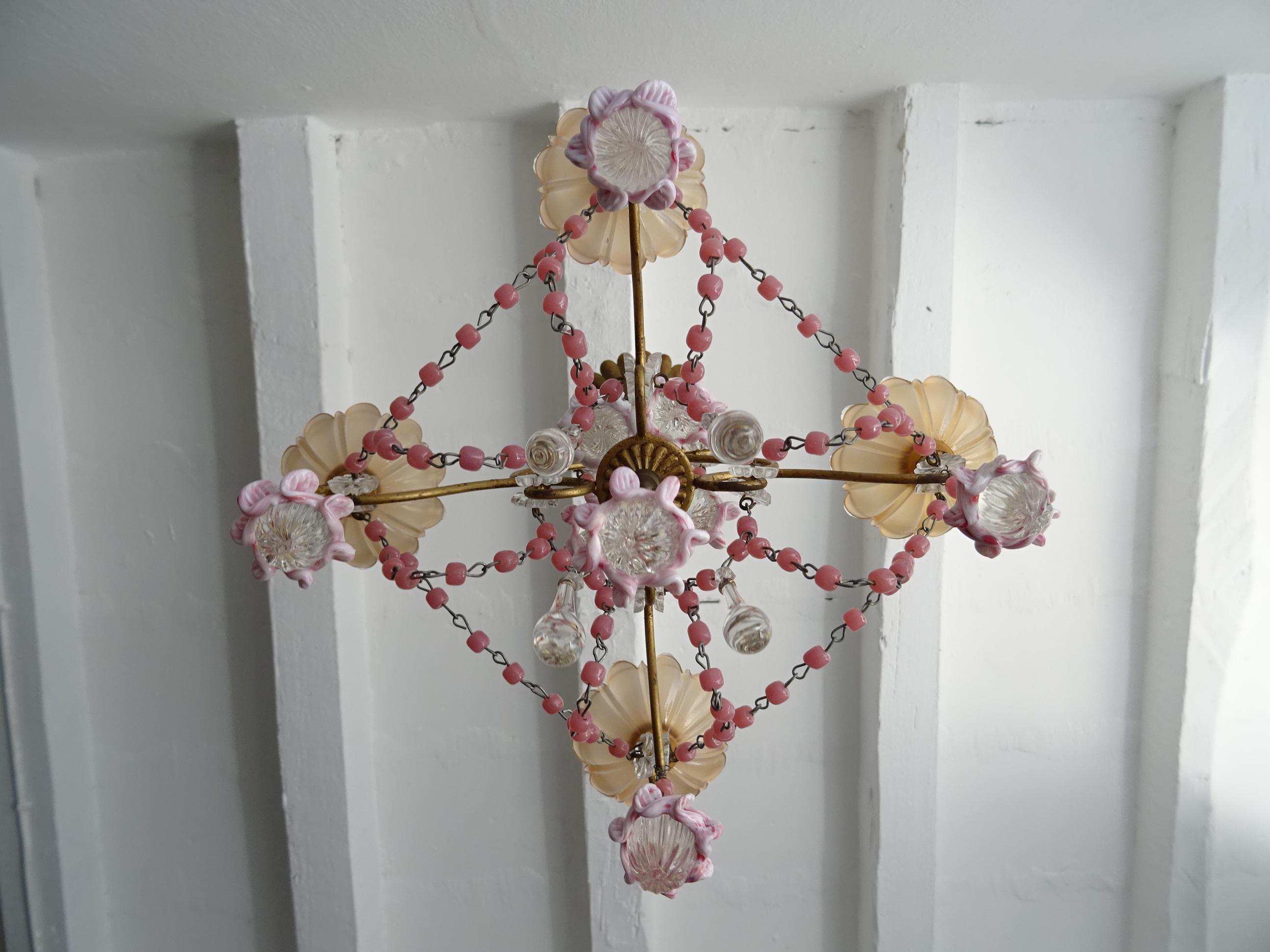 Housing four lights, sitting in pink opaline bobeches. Will be newly rewired with certified US UL sockets and appropriate sockets for all other countries and ready to hang. Swags of pink opaline beads and Murano pink ribbon balls. Adding small clear