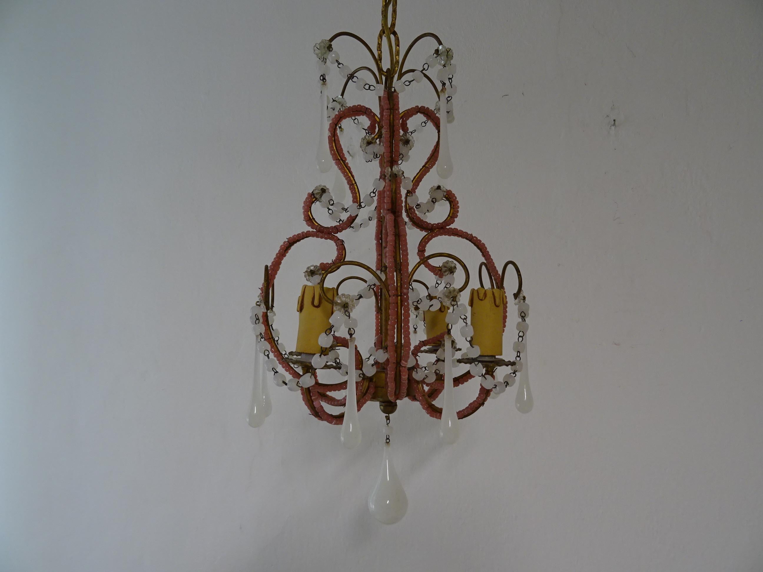 Housing 4 lights. Will be rewired with certified UL US sockets for the USA and appropriate sockets for all other countries and ready to hang. Double beaded with rare pink opaline beads. Swags of white opaline beads with white opaline Murano drops.