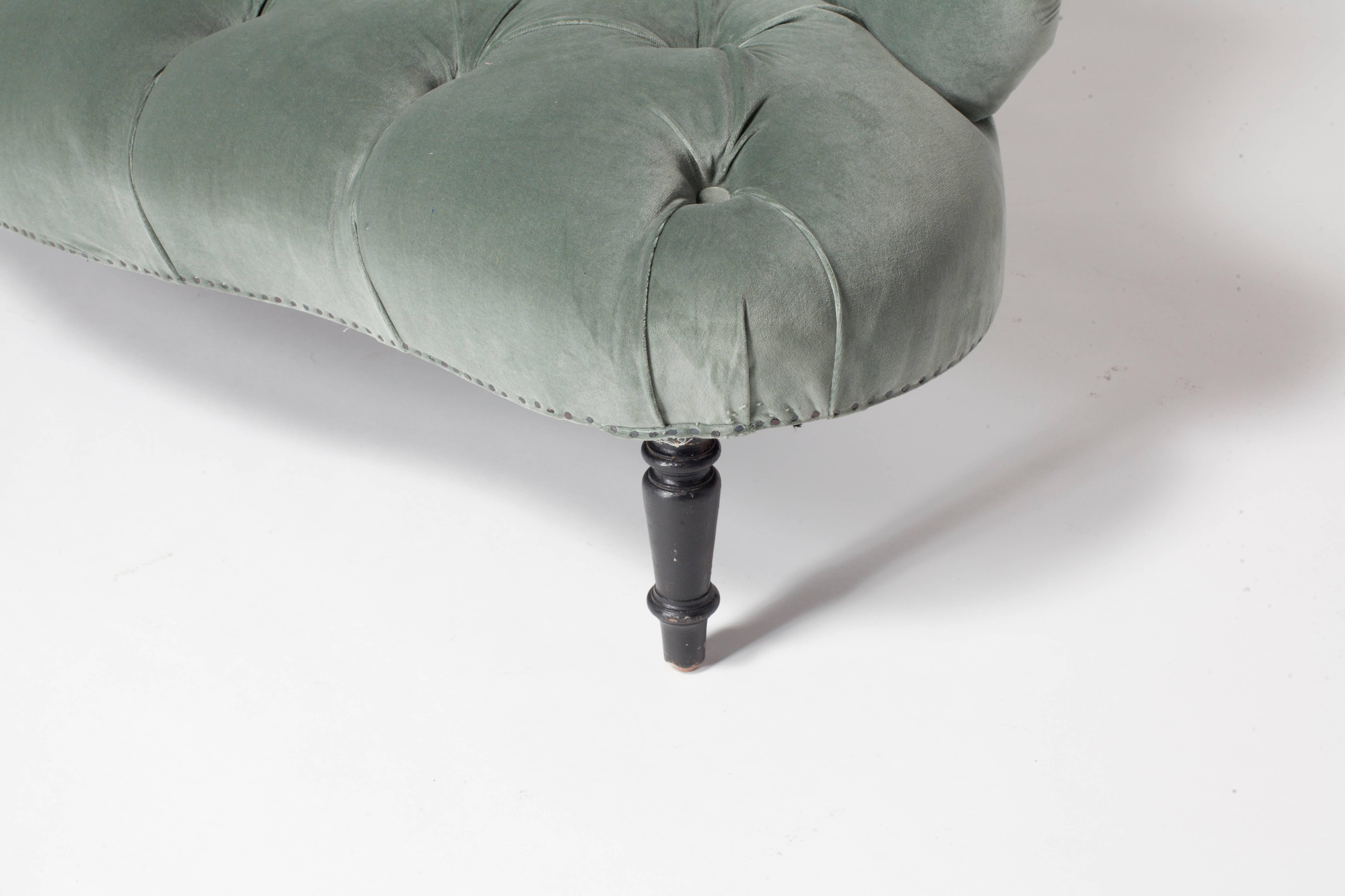 Sweet French petite tufted settee newly upholstered in beautiful blue grey velvet. Nails offer a nice 