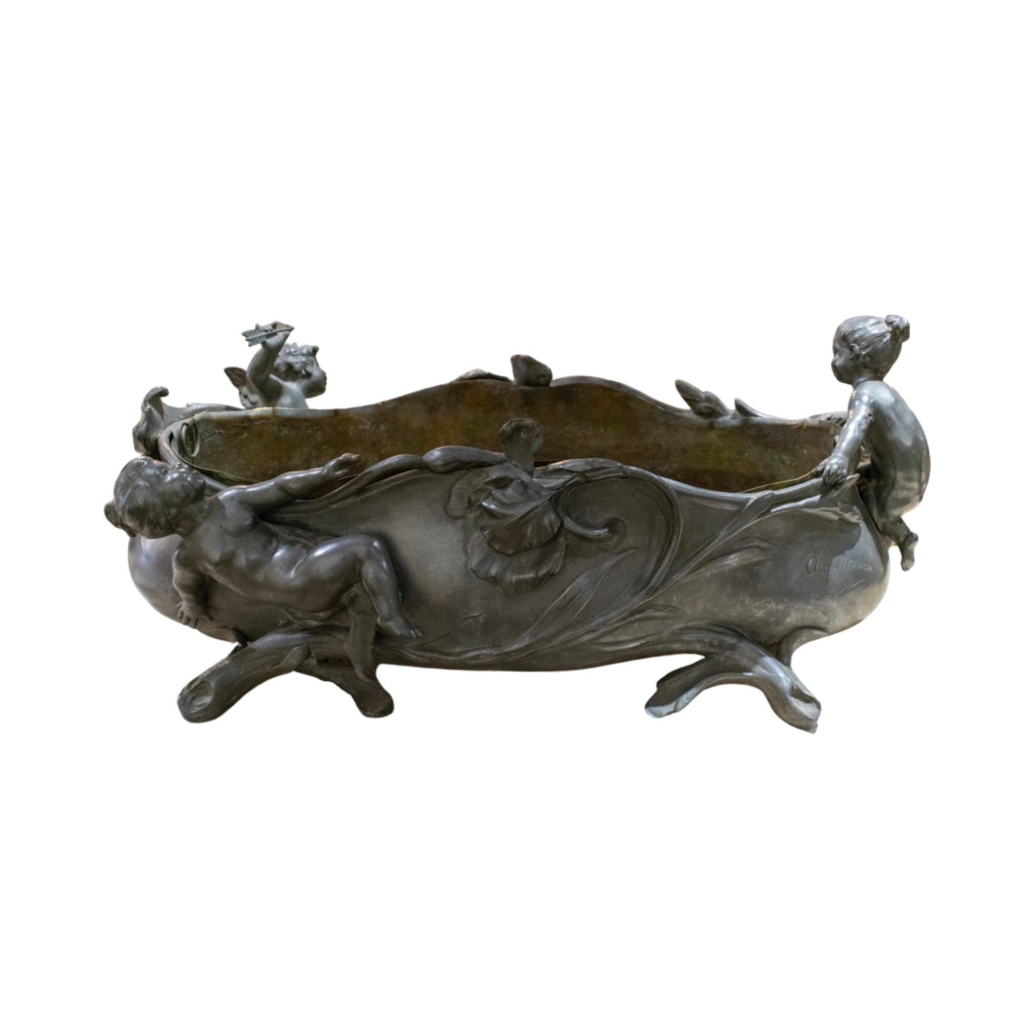 Decorative centerpiece made out of Pewter. Shallow opening in the center for storage. Craved angel figures along the sides. Originates from France. Signed by Oval Jardiniere. Circa, 1880's.
Regular price
$2,500.00.