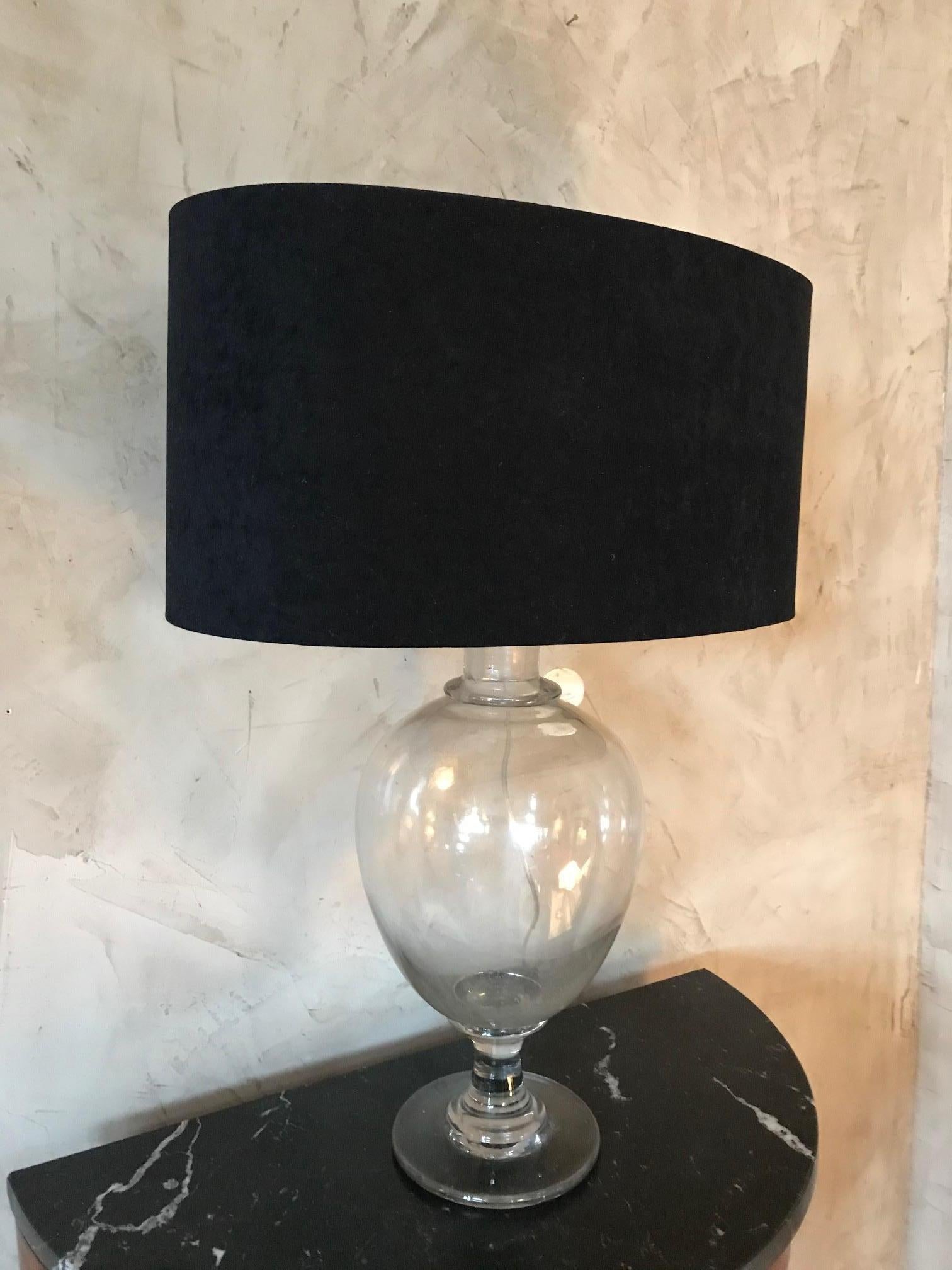 Beautiful pharmacy flacon from the late 19th century has been changed as a Table lamp with a black velvet lampshade. 
Very nice lightening of this lampshade. 
High quality.