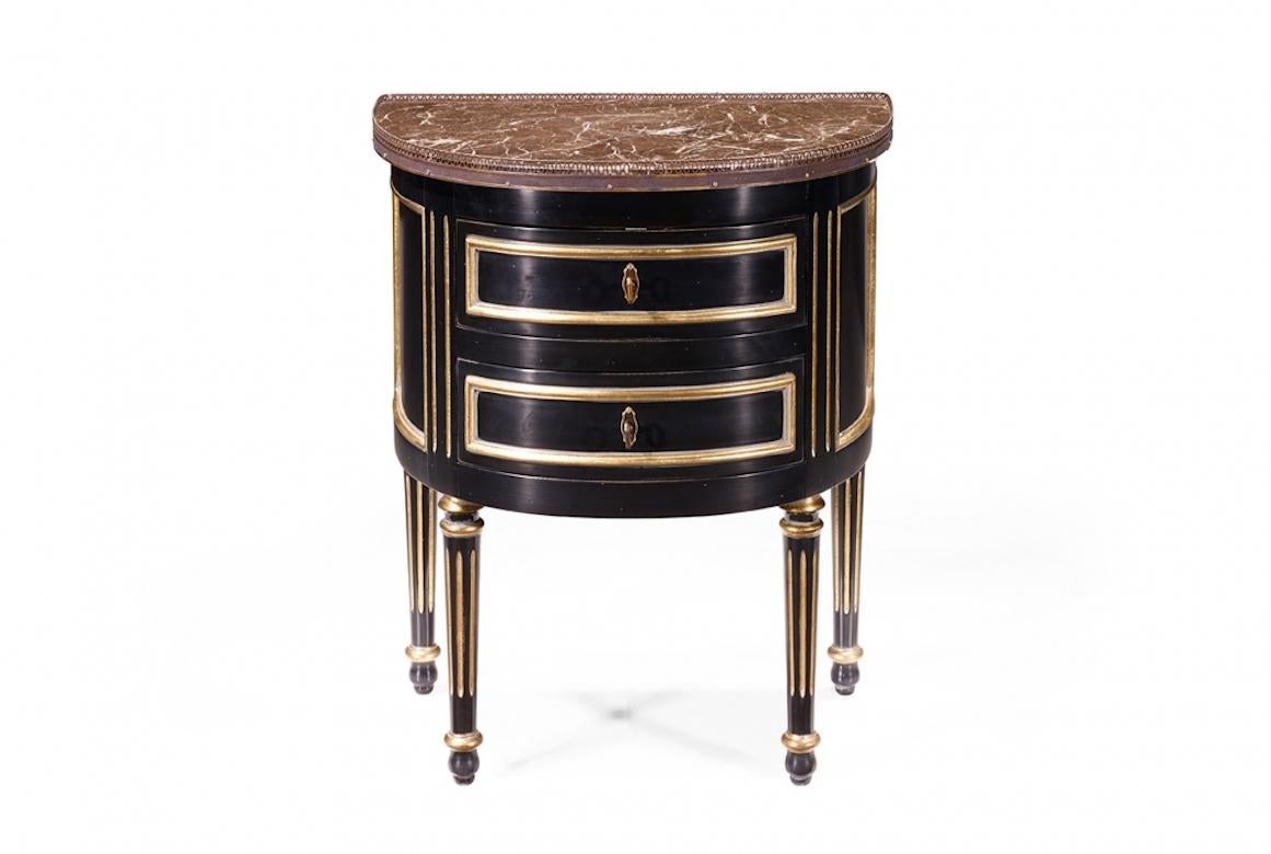 A stunning French Picard Louis XVI Bouillotte bedside table, 20th century.

Picard is a Louis XVI Bouillotte bedside table shown in antique black with details in gold leaf. It features a marble top and decorative gallery in antique brass. Details