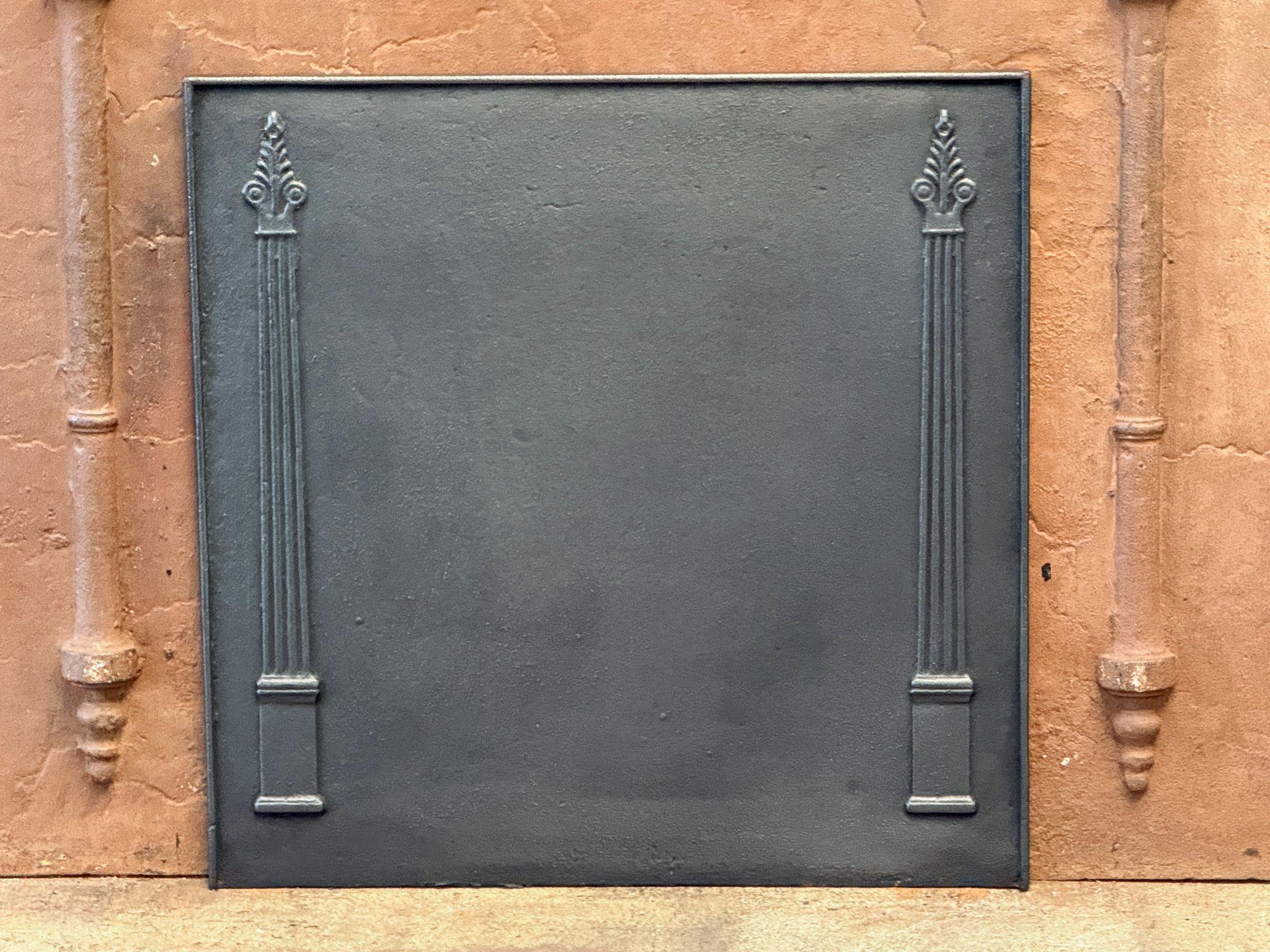19th century French neoclassical fireback with two pillars of freedom. The pillars symbolize the value of liberty, one of the three values of the French Revolution.

The fireback is made of cast iron and has a black/pewter color. It is in good