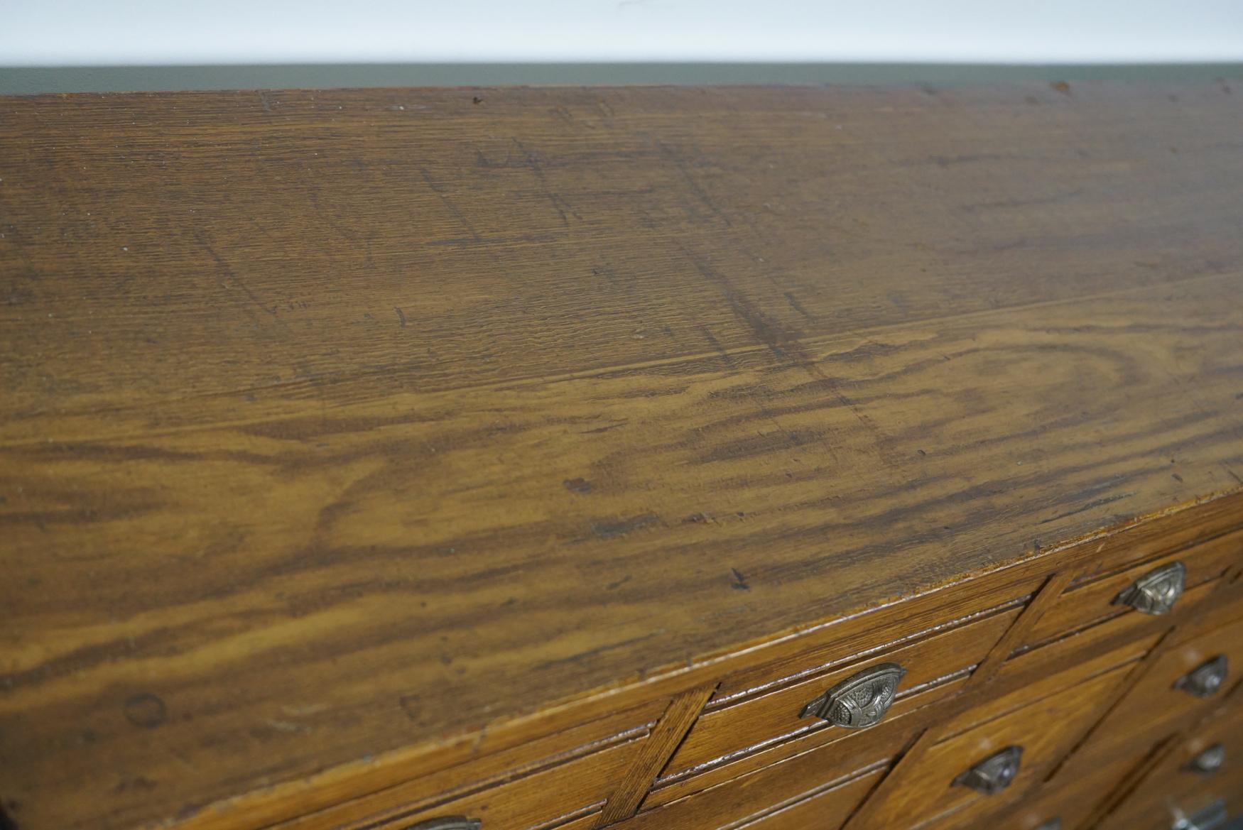 Early 20th Century French Pine Apothecary Cabinet in Faux Oak Paint