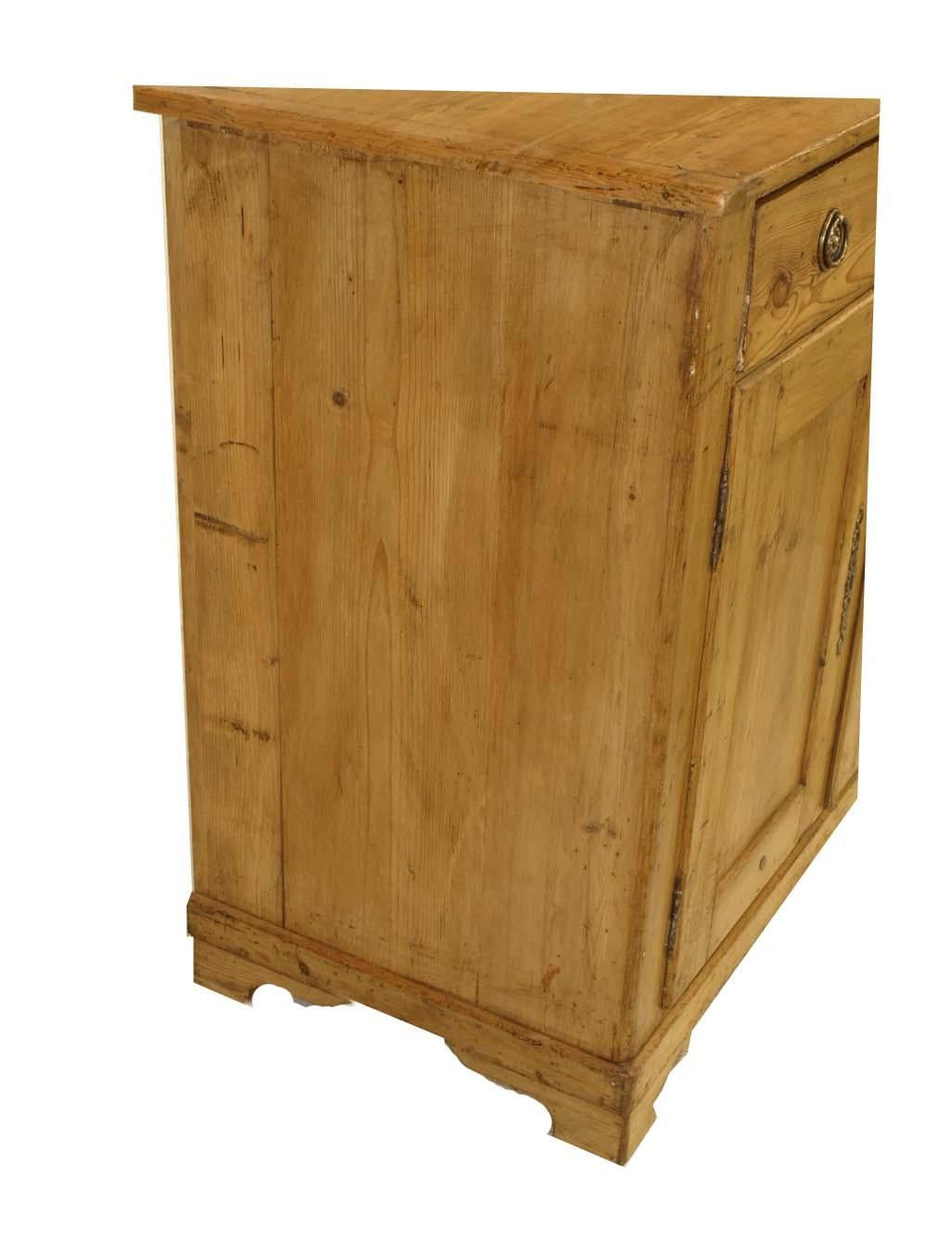 French pine buffet, the top has ''bread board'' ends above single drawer with ring pulls, double doors below with interior shelf. This piece has a clear wax finish.