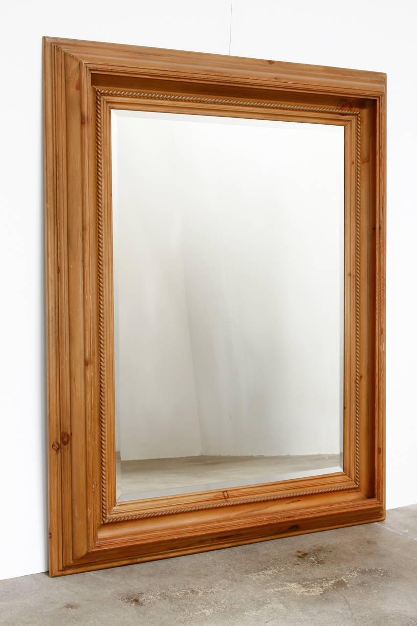Rustic French pine rope twist mirror featuring beveled glass. Nearly 4 inch deep carved double frame that can be hung either way with attached hardware. Natural finish with a warm pine glow and lovely knotted grain patterns.