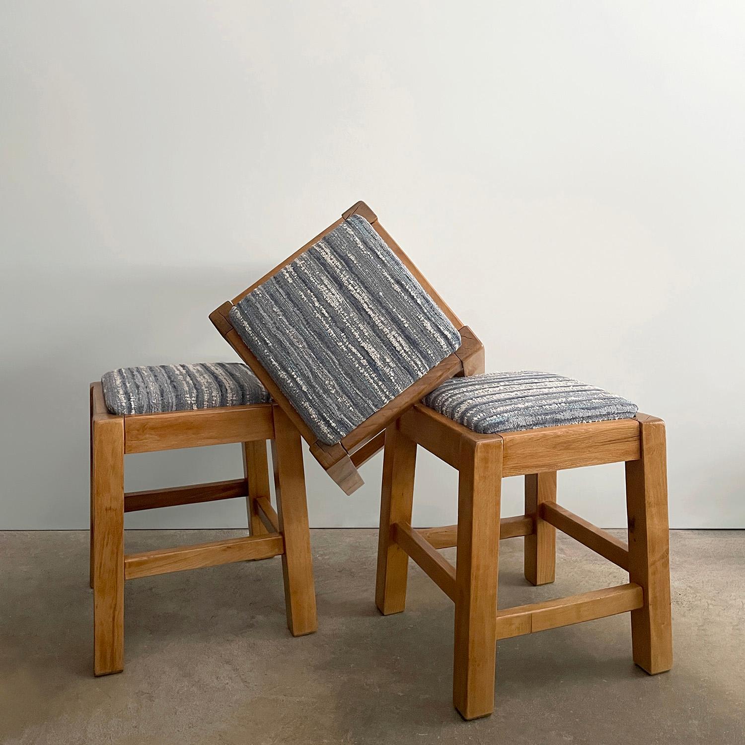French pine stools
France, mid century
Solid wood angular frames with lovely grain detail
Minor splitting but structurally sound
Natural color variations
Newly reconditioned wood and reupholstered seats
Patina from age use
Three stools