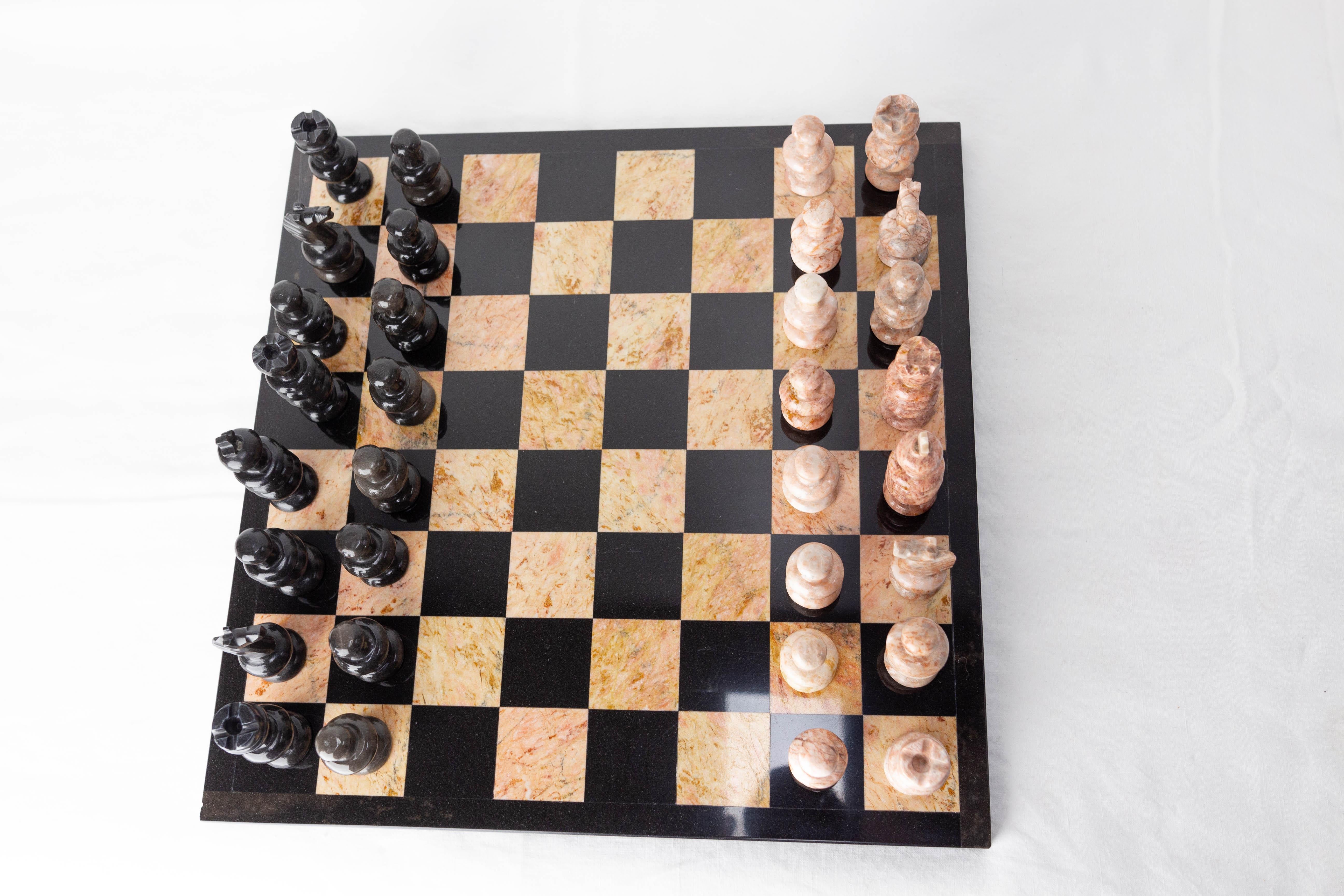 Chess in pink and black marble.
Made circa 1980, each piece is handmade.
Two of the pink piece were restored after a shock (please see photos), nothing disturbing.
Height of the pieces:
from 1.97 to 3.15 in. (5 to 8 cm)

Shipping:
36 / 36 /