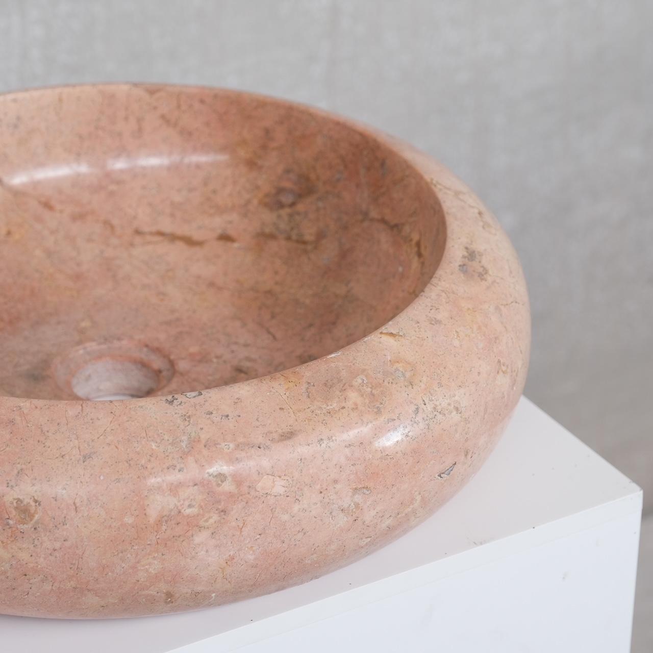 A vintage pink marble sink.

Circular bowl shape.

Ideal for re-use in a bathroom. Perhaps over an antique drawers or Primitive table.

France, circa 1960s.

Solid marble.

Some scuffs and wear commensurate with age.

Location: Belgium