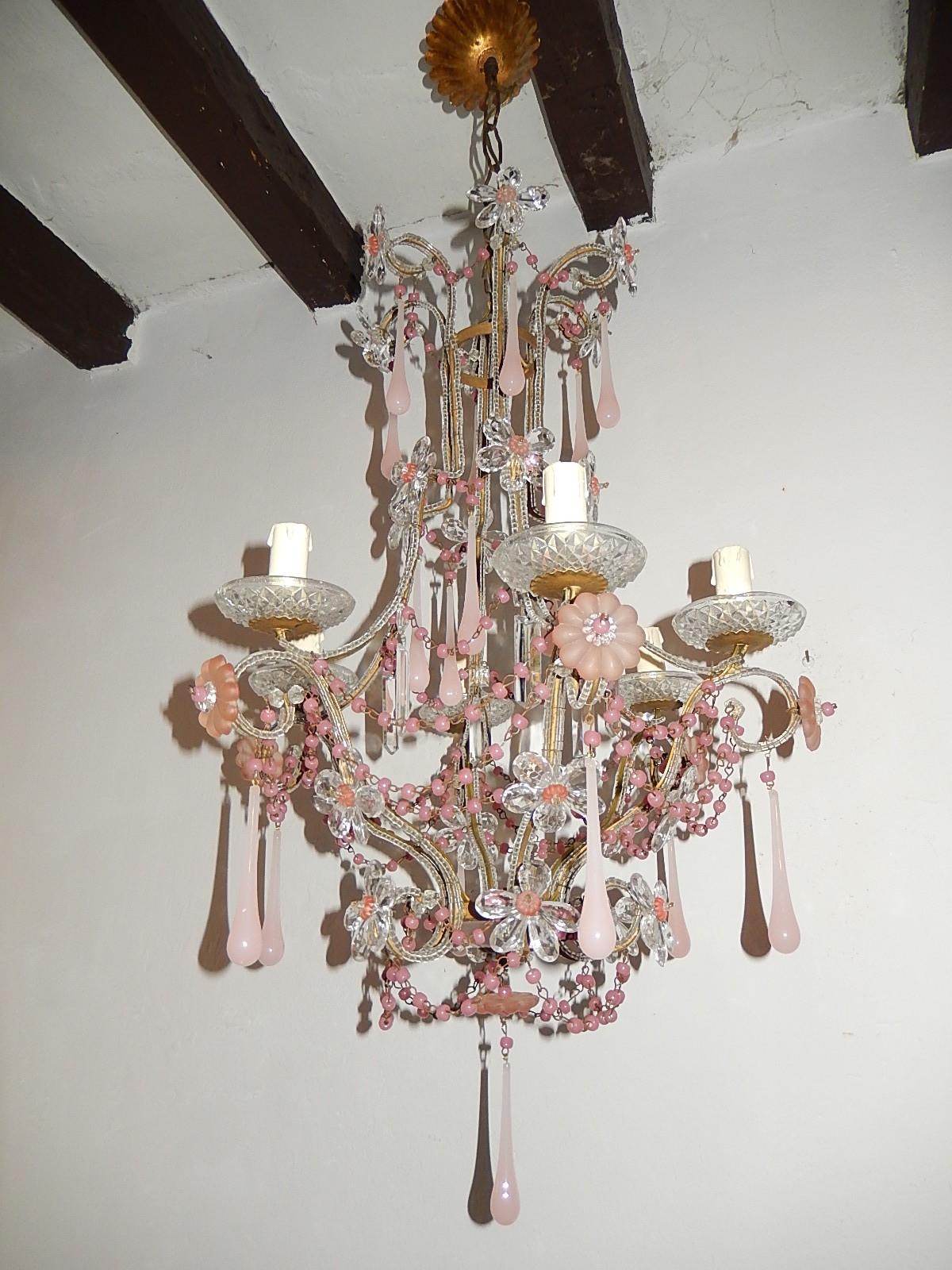 Housing six lights, sitting in crystal cut bobèches. Rewired and ready to hang. Double beaded throughout with rare pink opaline Murano drops and pink opaline swags throughout. Pink opaline cup on bottom. Adorning crystal prisms making up flowers