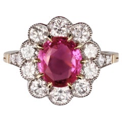 Anello francese con zaffiro rosa e diamanti in oro giallo 18 carati e platino a margherita