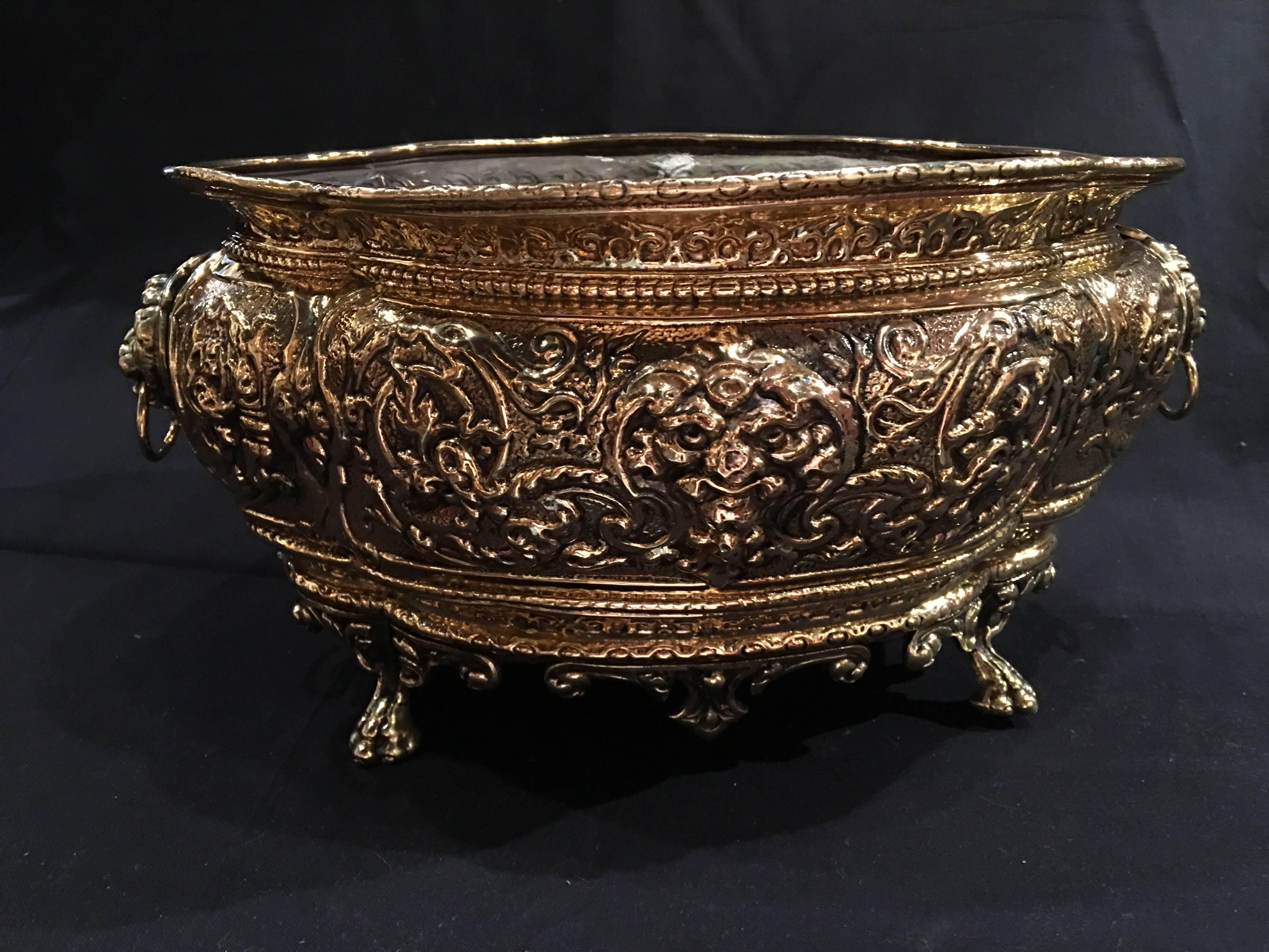 French polished brass jardiniere or planter on paw feet, 19th century.